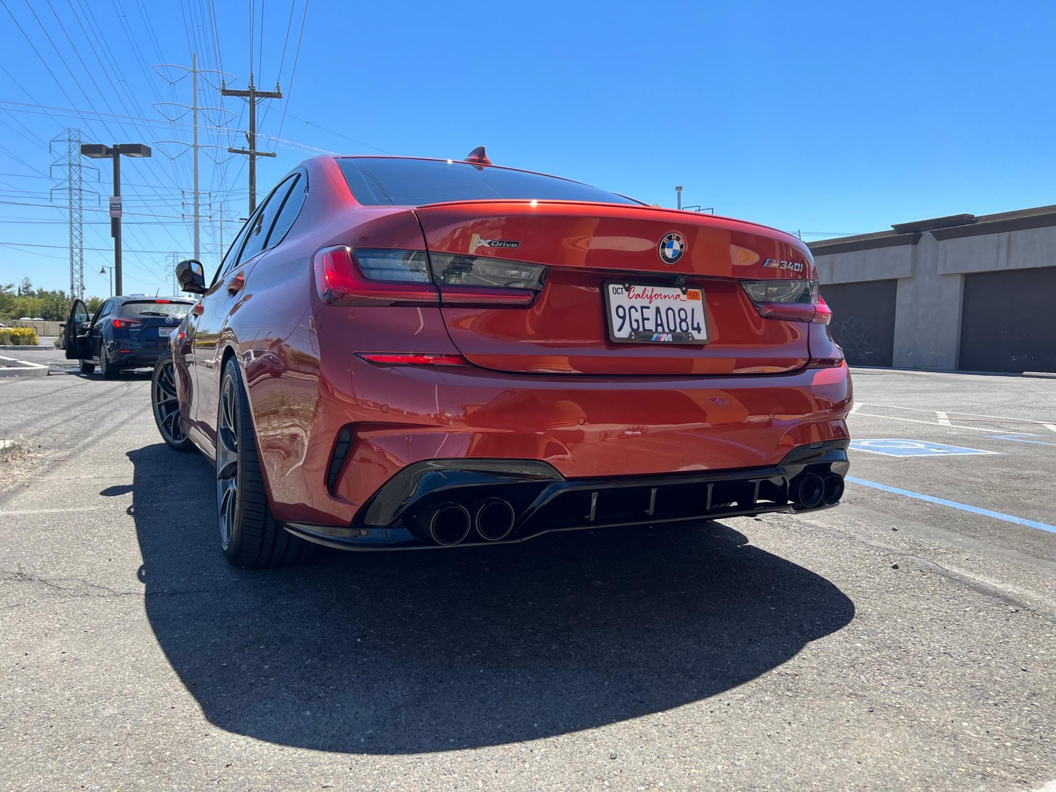 Orange BMW G20 Sedan 3 Series with 19" VS-5RS Apex wheels in Anthracite