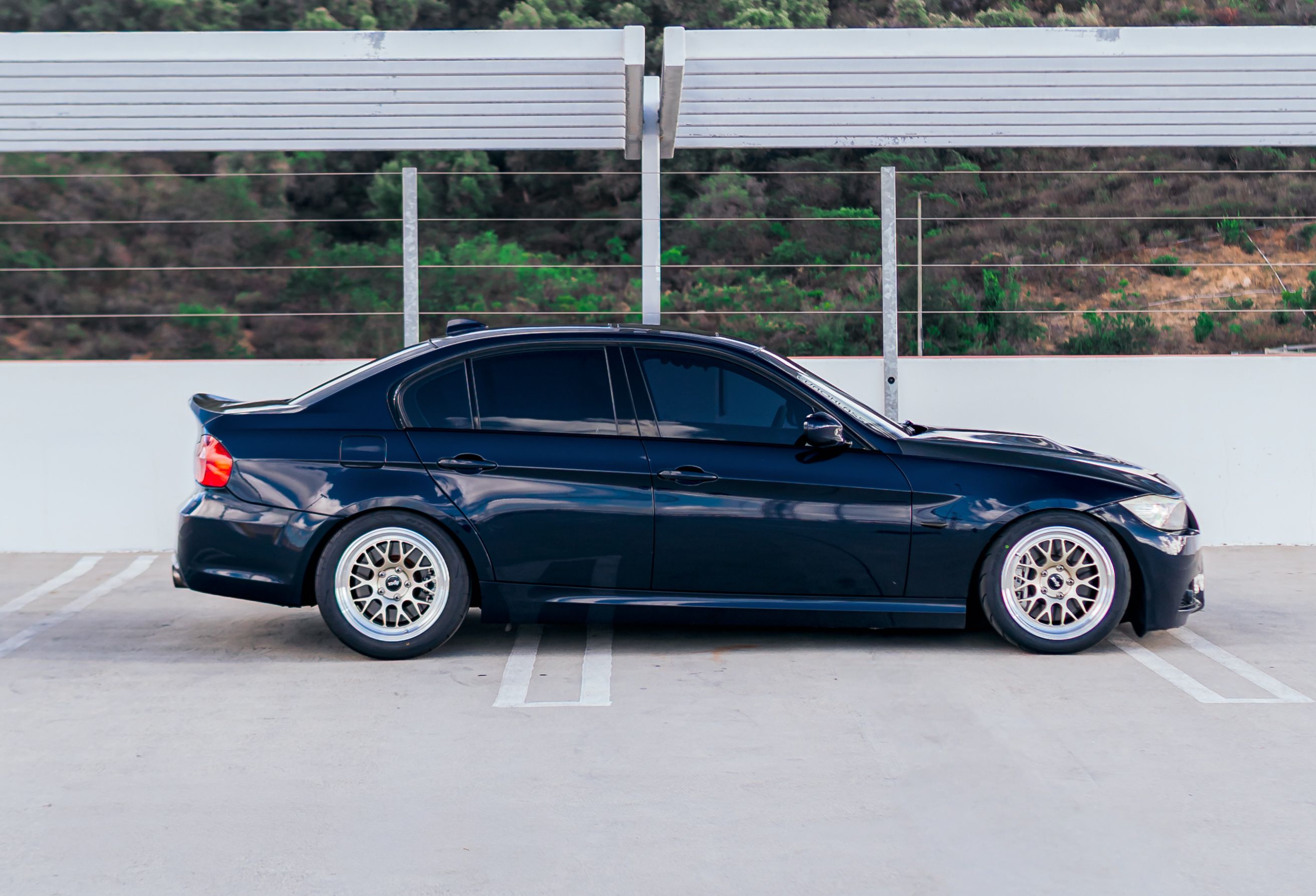 Black BMW E90 Sedan 3 Series with 17" ML-10RT Apex wheels in Machined Lip Gloss Motorsport Gold