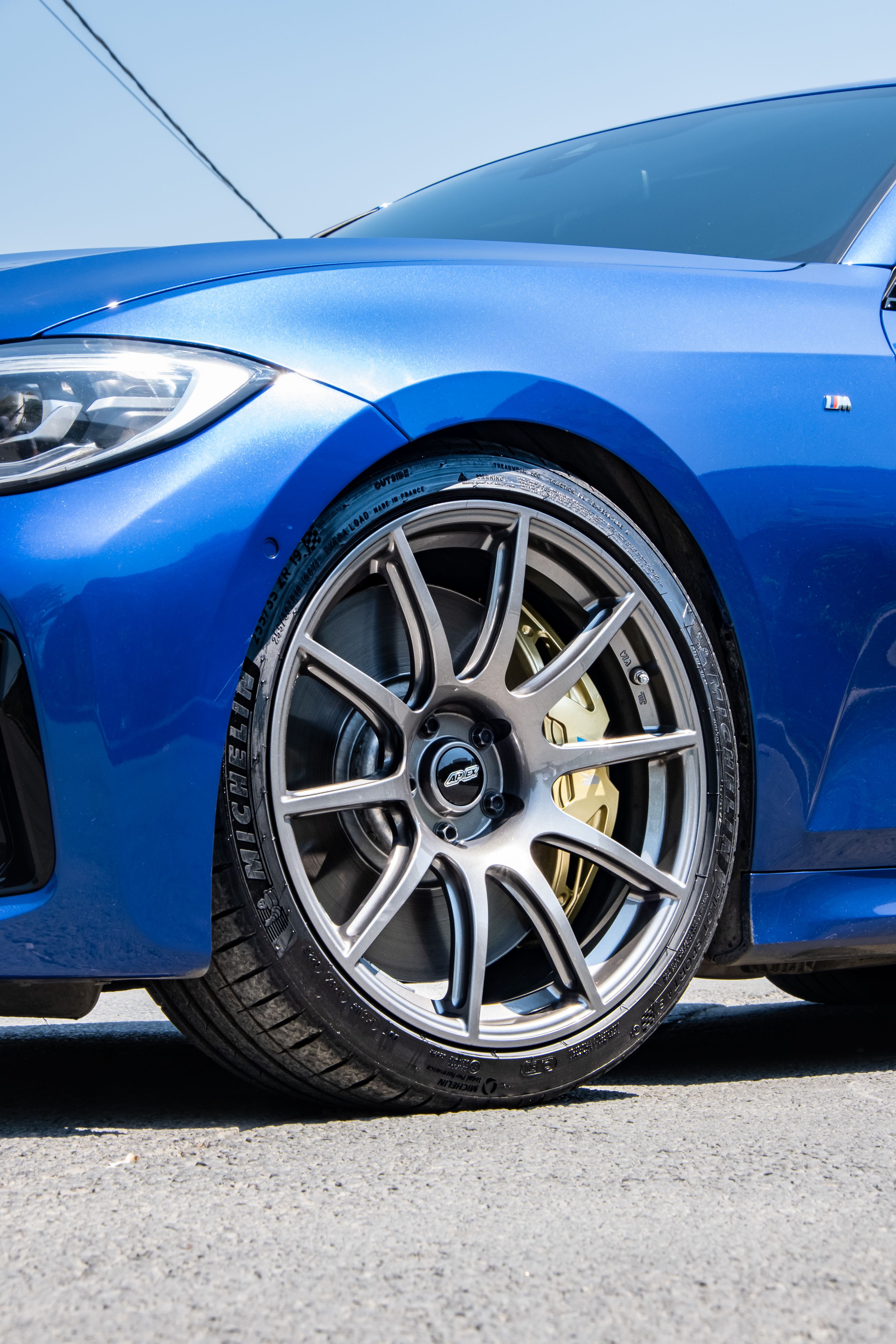 Blue BMW G20 Sedan 3 Series with 19" SM-10 Apex wheels in Anthracite