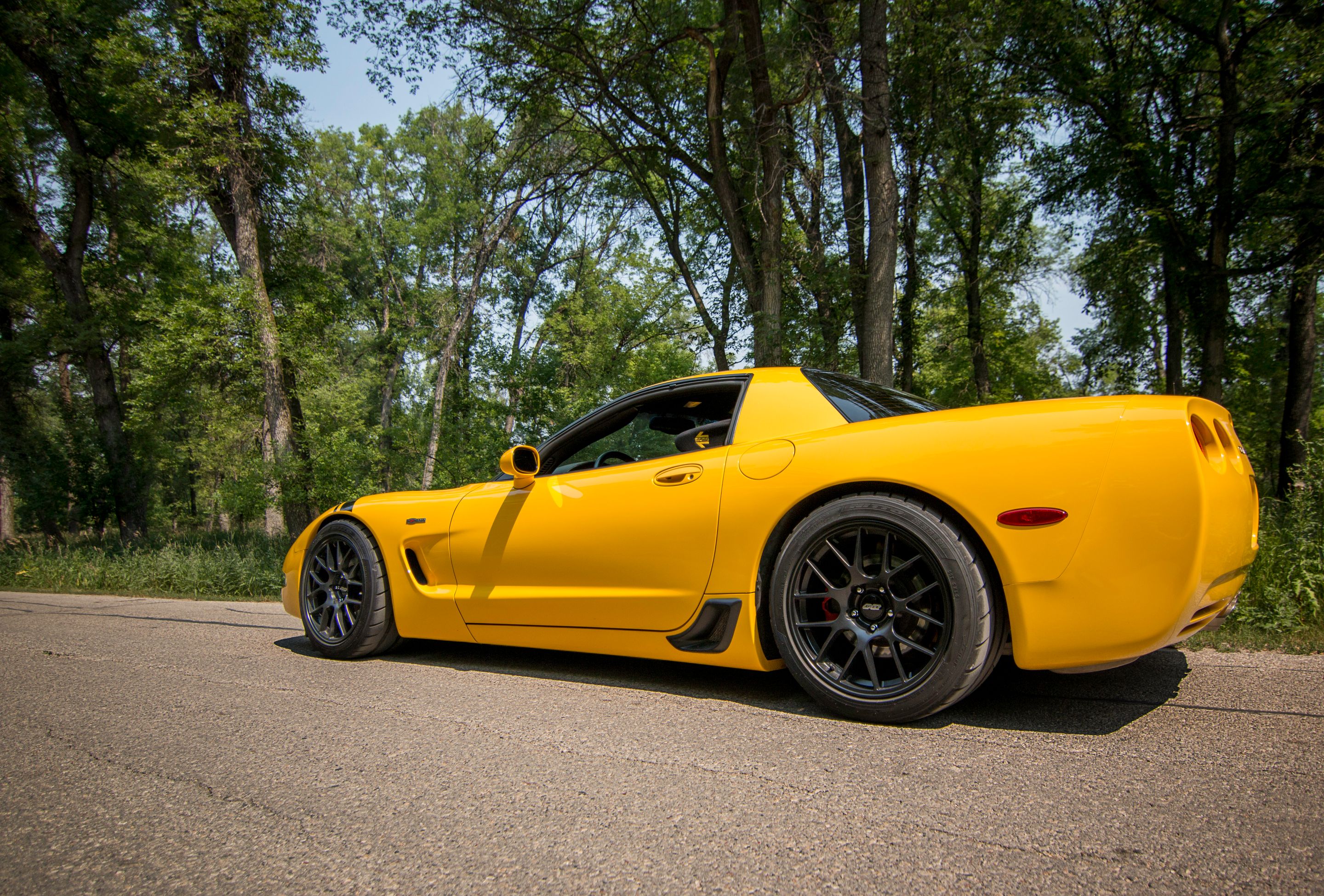Yellow Chevrolet C5 Corvette Z06 with 18" EC-7 Apex wheels in Satin Black