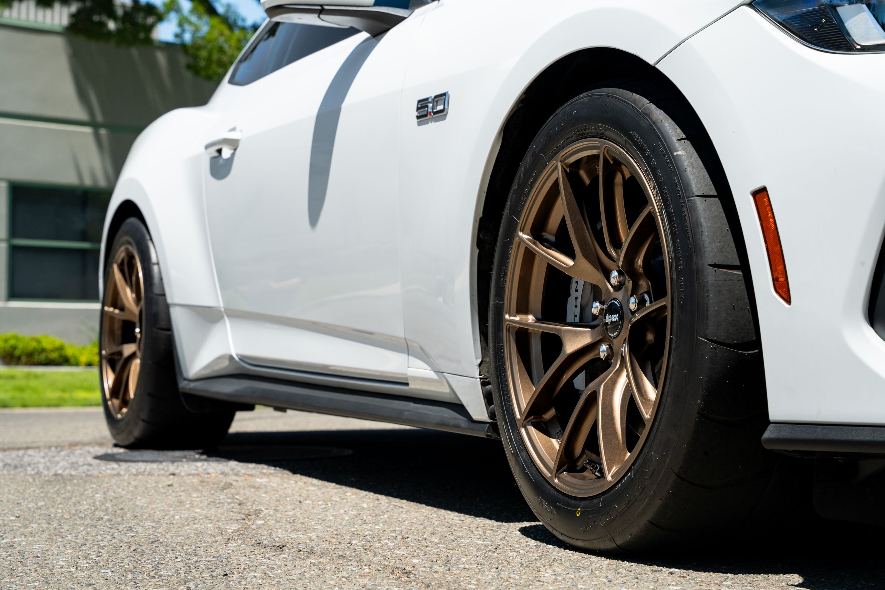 White Ford S650 Mustang GT with 18" VS-5RS Apex wheels in Satin Bronze