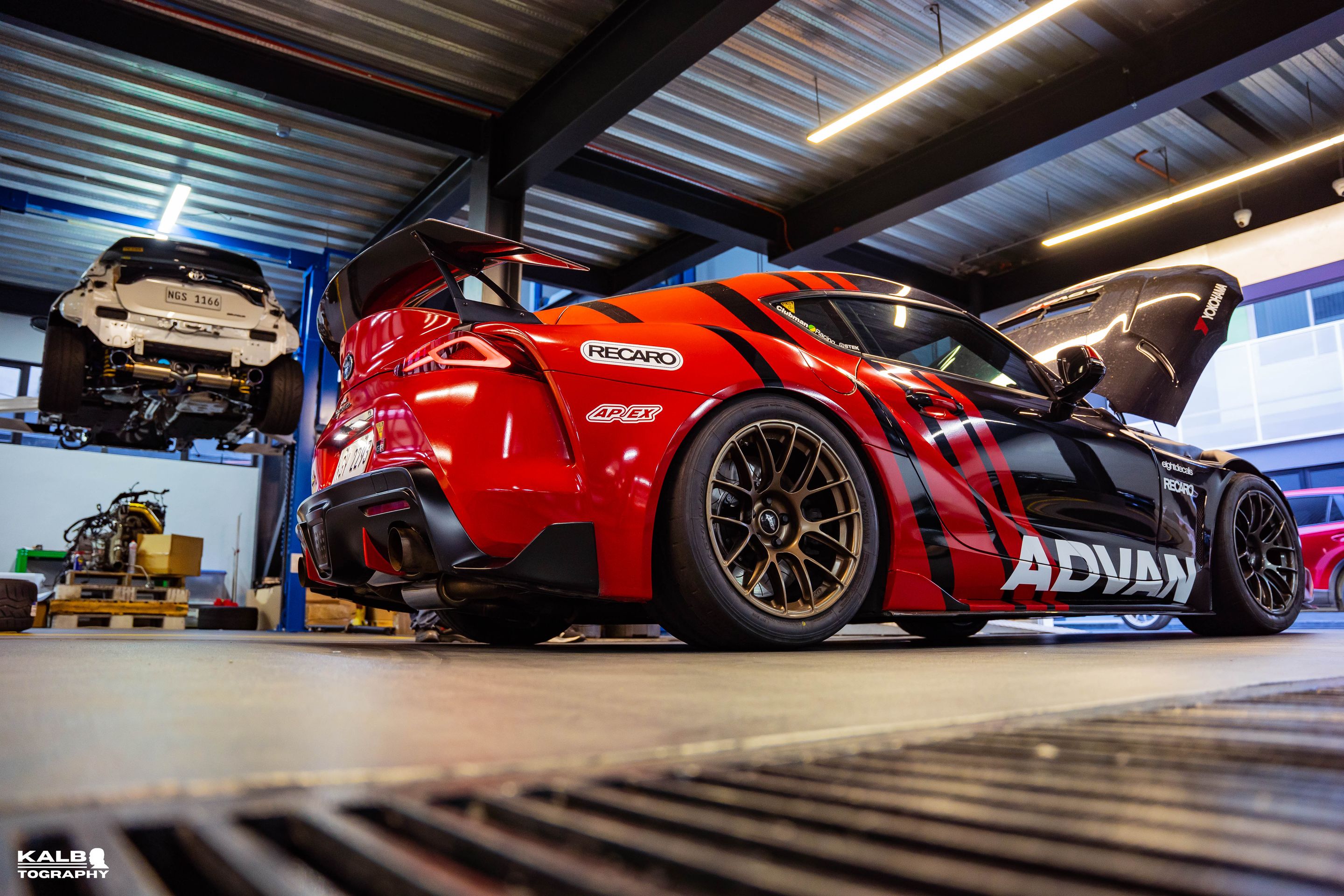 Black Toyota GR Supra with 18" EC-7RS Apex wheels in Satin Bronze