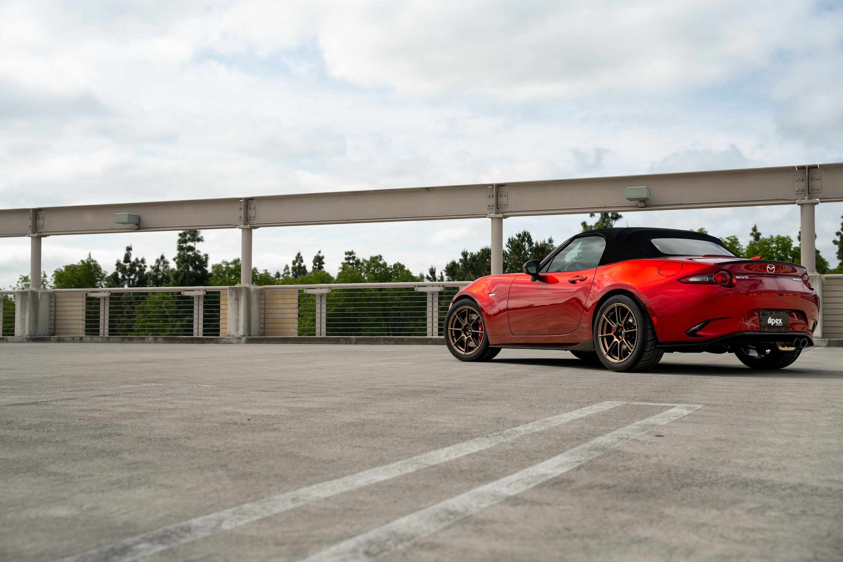 Red Mazda ND MX-5 Miata with 17" SM-8RS Apex wheels in Satin Bronze