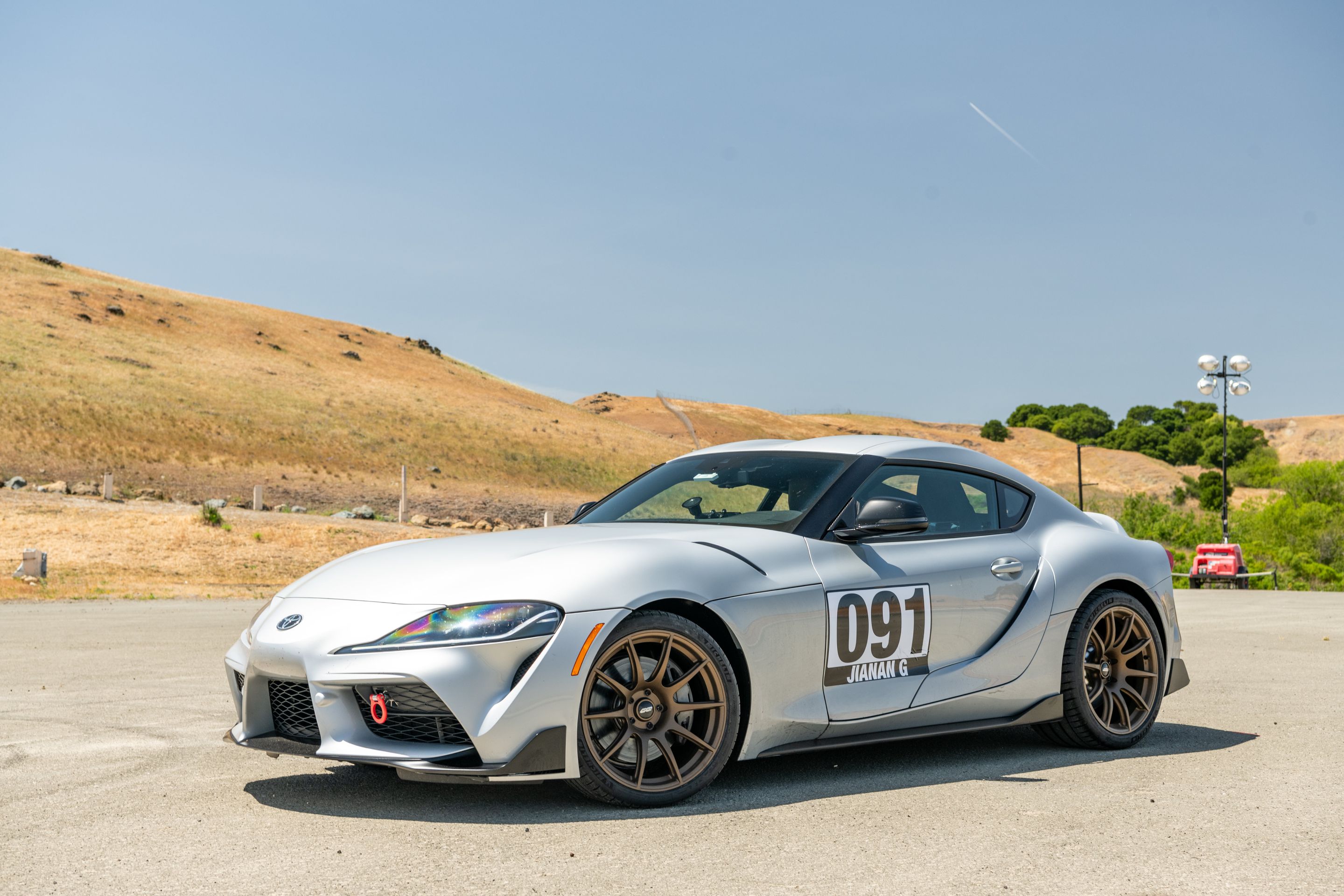 Silver Toyota GR Supra with 19" SM-10 Apex wheels in Satin Bronze