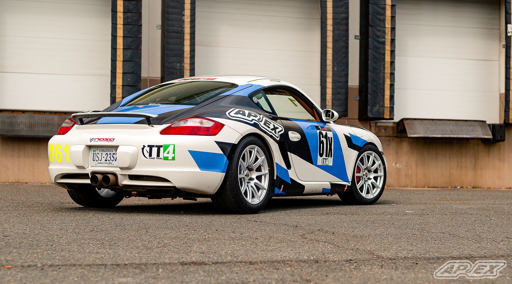 White Porsche 987 Cayman S with 18" SM-10 Apex wheels in Race Silver