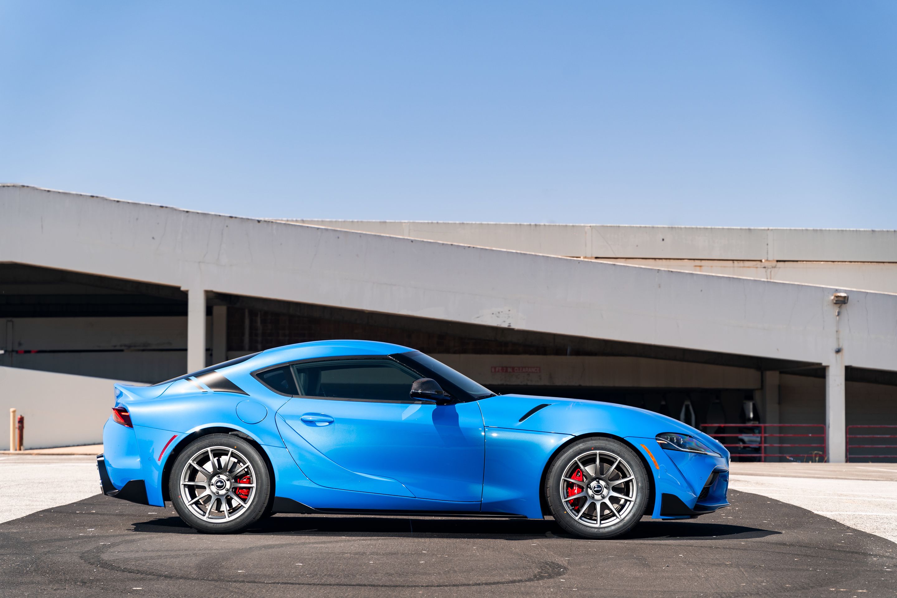 Blue Toyota GR Supra with 18" SM-10 Apex wheels in Anthracite