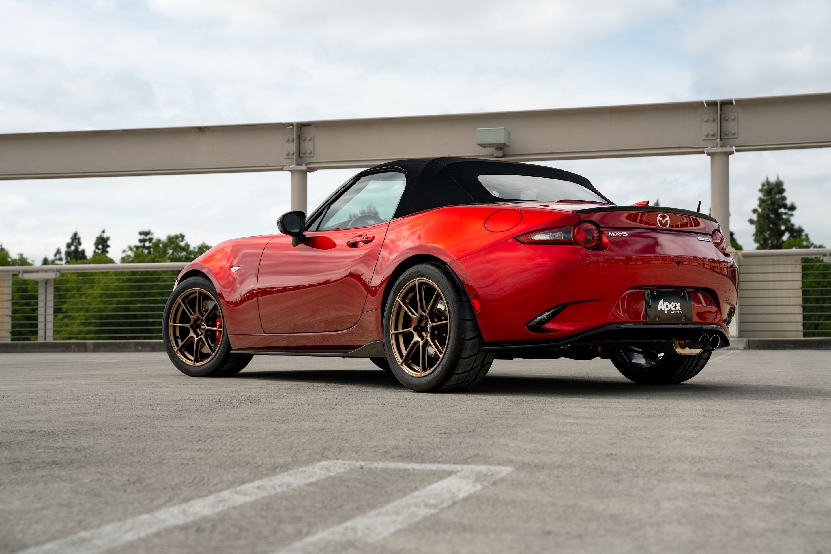 Red Mazda ND MX-5 Miata with 17" SM-8RS Apex wheels in Satin Bronze