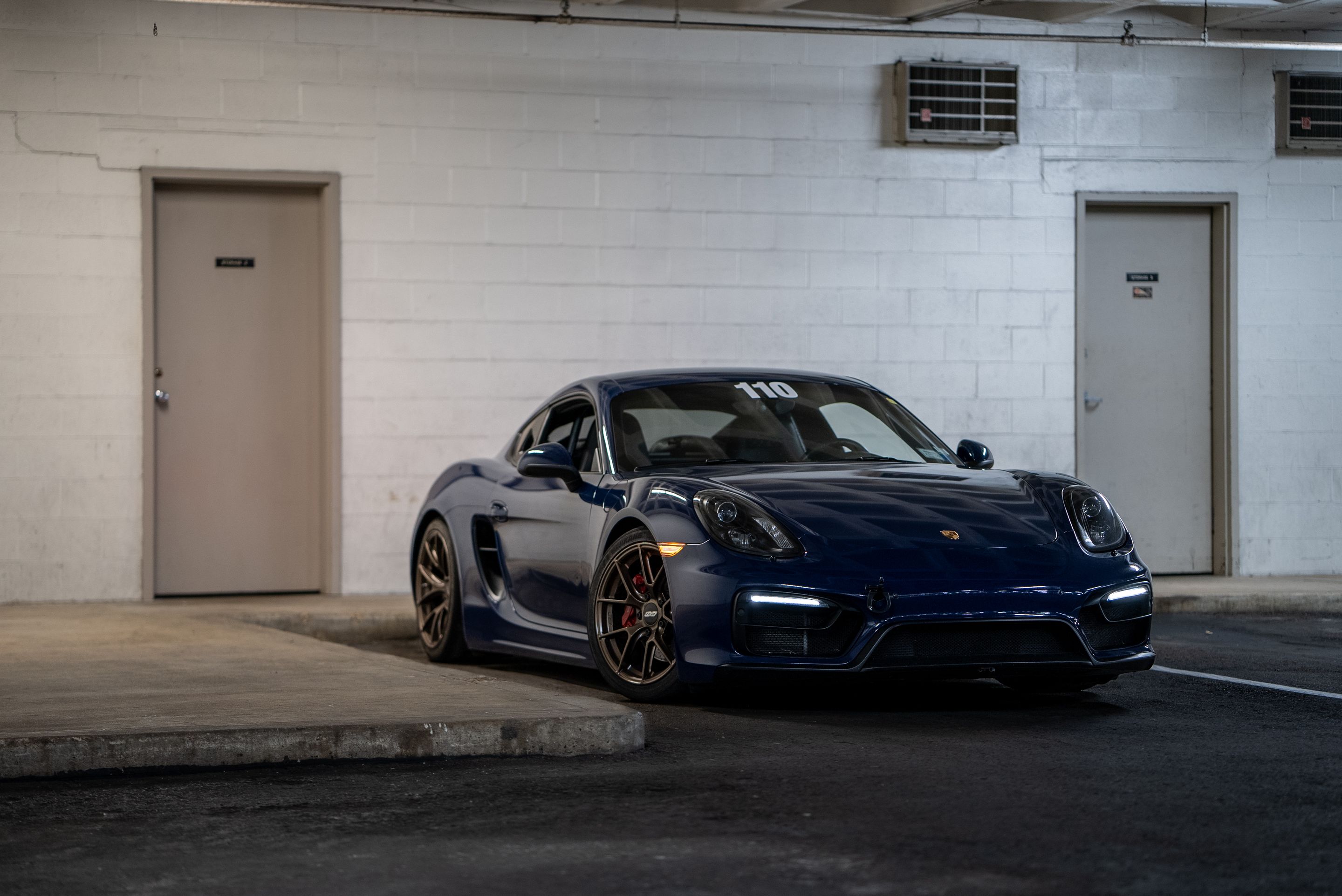 Blue Porsche 981 Cayman GTS with 18" VS-5RS Apex wheels in Satin Bronze