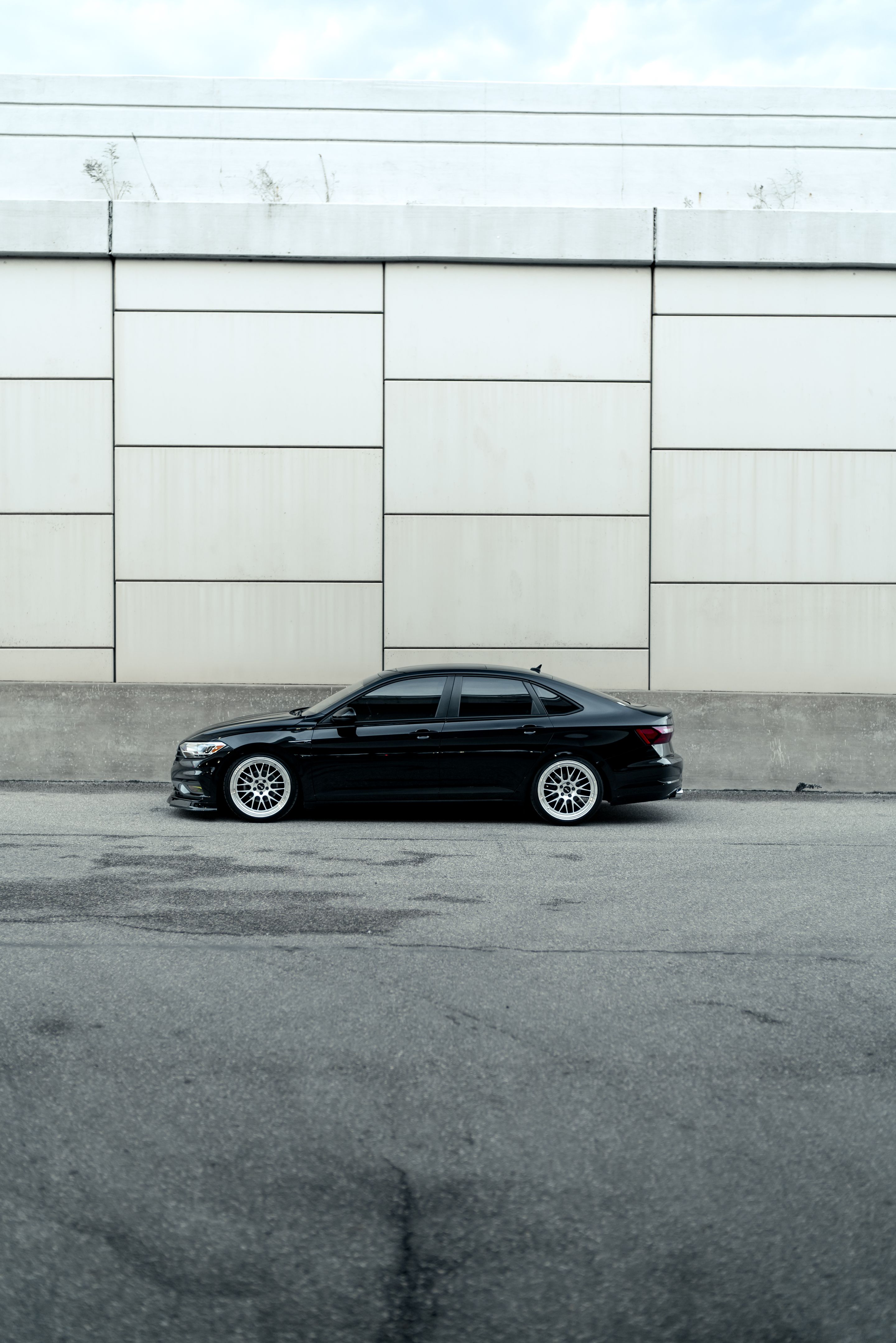 Black VW MK7 Jetta with 19" ML-10RT Apex wheels in Machined Lip Race Silver