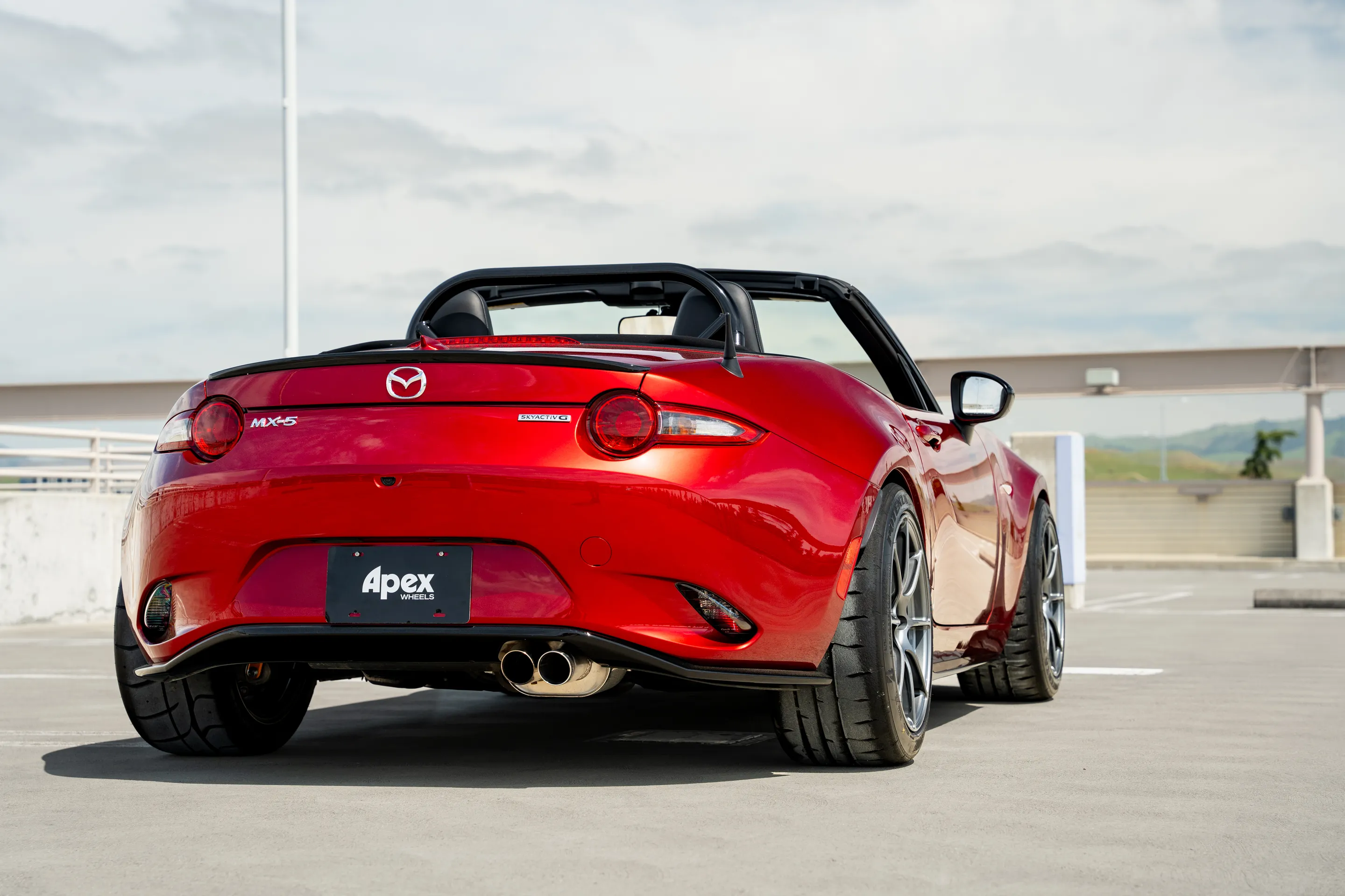 Red Mazda ND MX-5 Miata with 17" SM-8RS Apex wheels in Anthracite