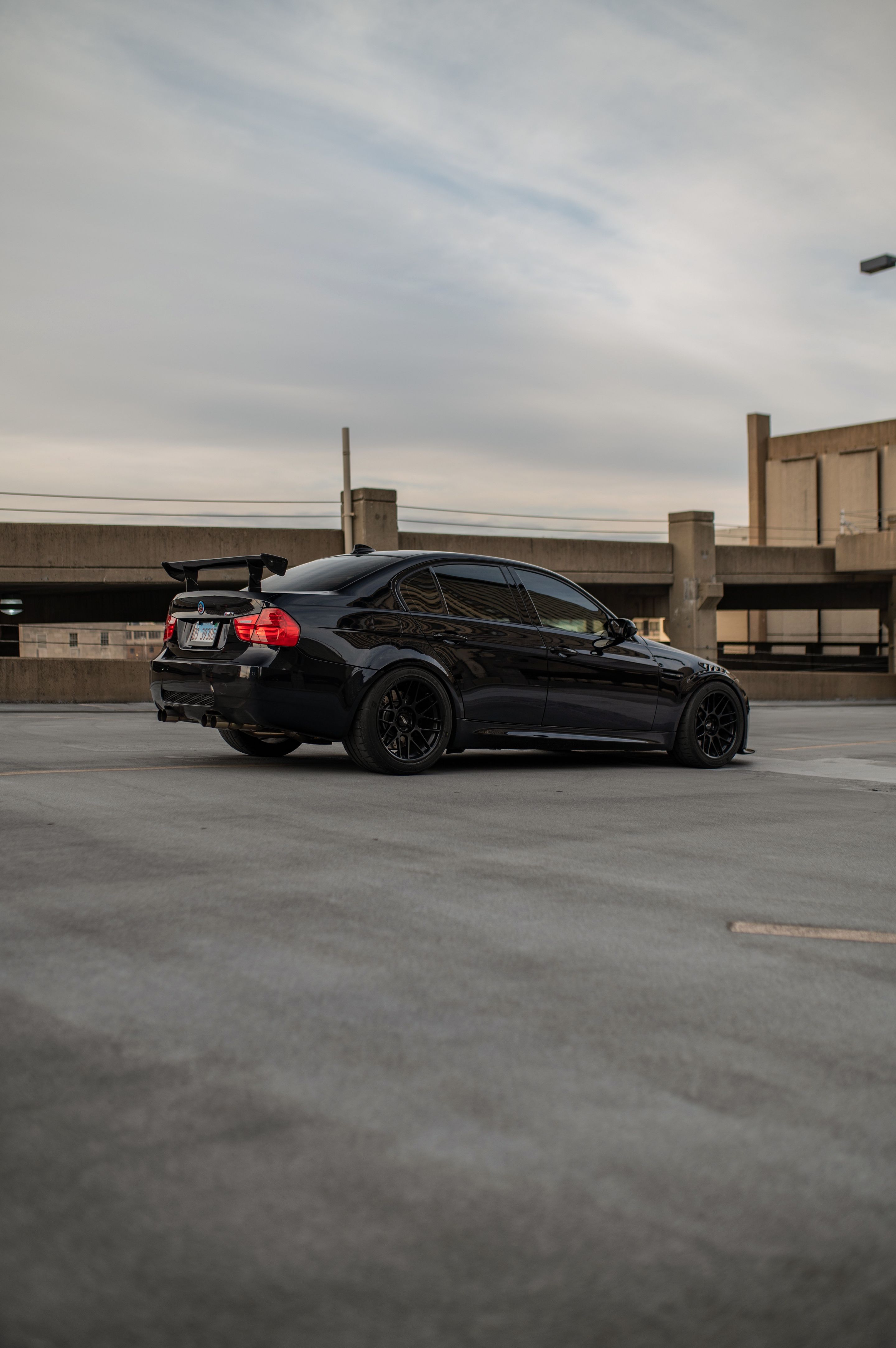 Black BMW E90 Sedan M3 with 18" ARC-8 Apex wheels in Satin Black