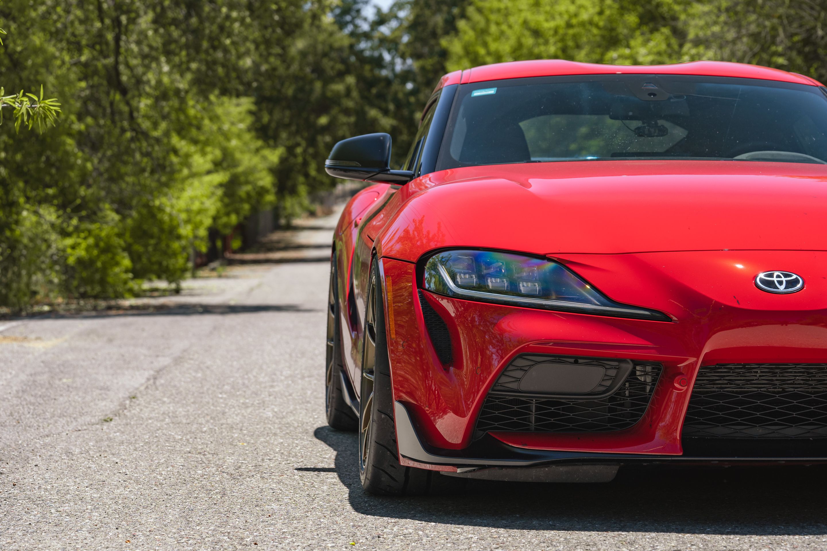 Red Toyota GR Supra with 19" VS-5RS Apex wheels in Satin Bronze