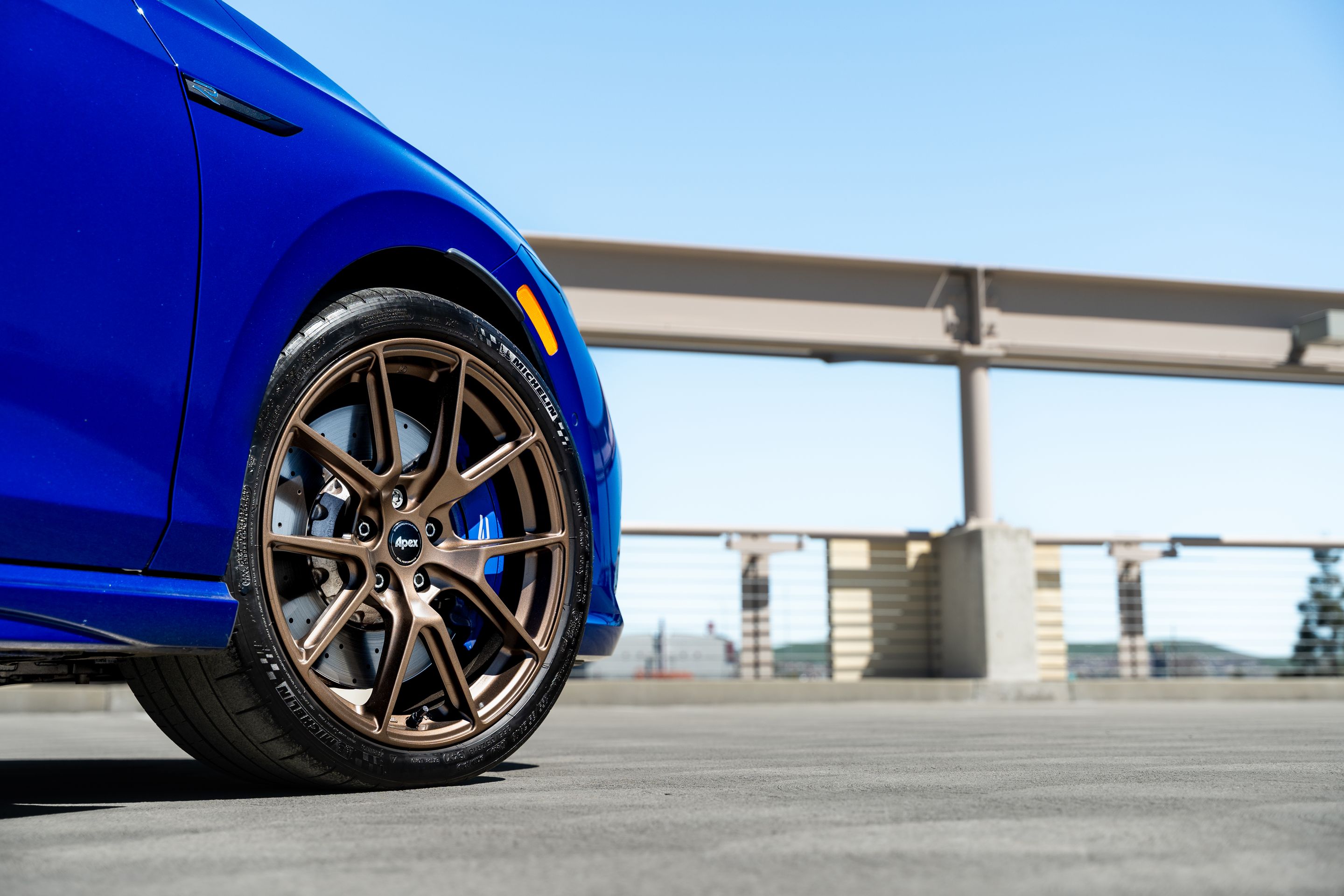Blue VW MK8 Golf R with 18" VS-5 Apex wheels in Satin Bronze