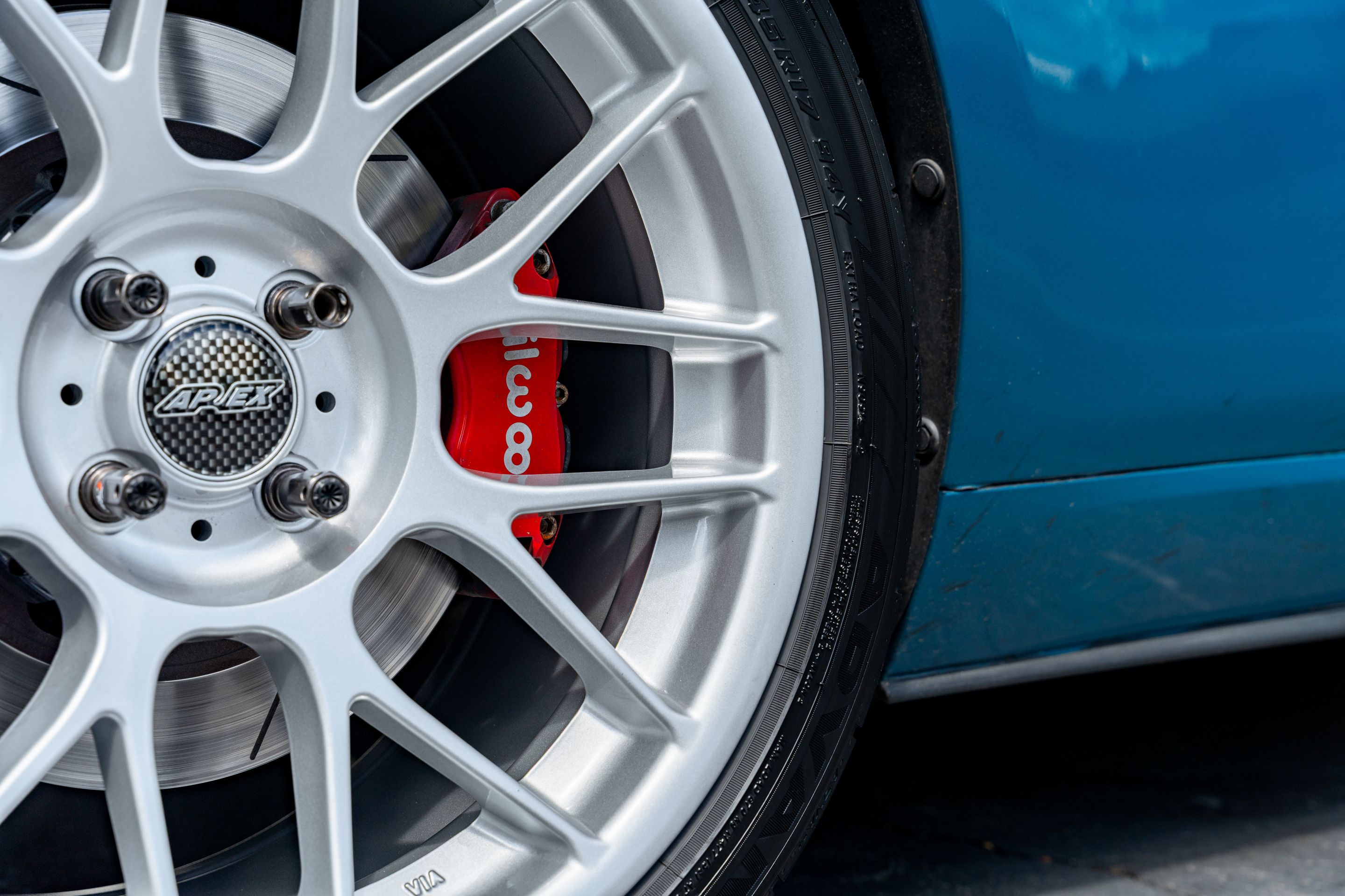 Blue Mazda ND MX-5 Miata with 17" ARC-8 Apex wheels in Race Silver