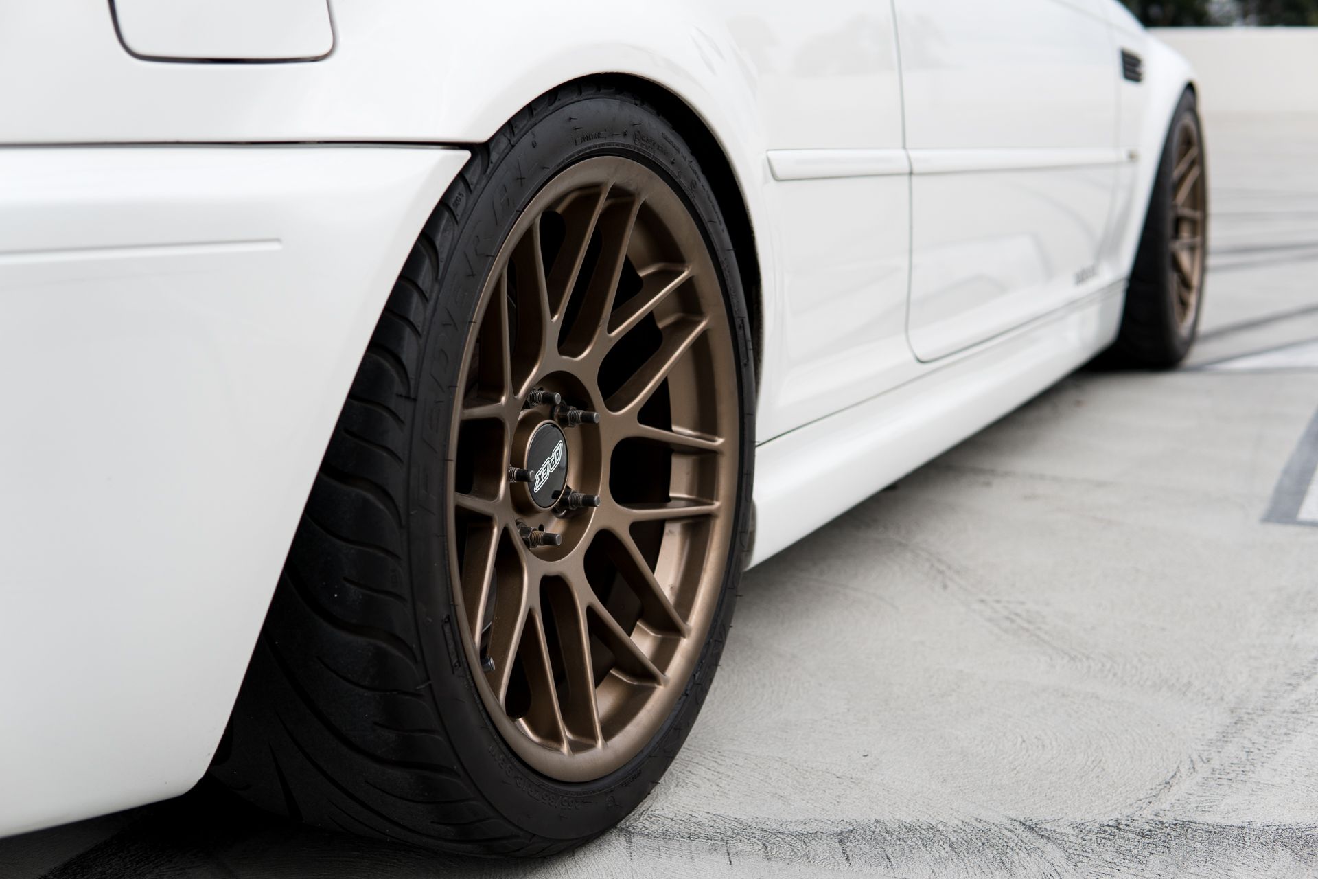 White BMW E46 M3 with 18" ARC-8 Apex wheels in Satin Bronze