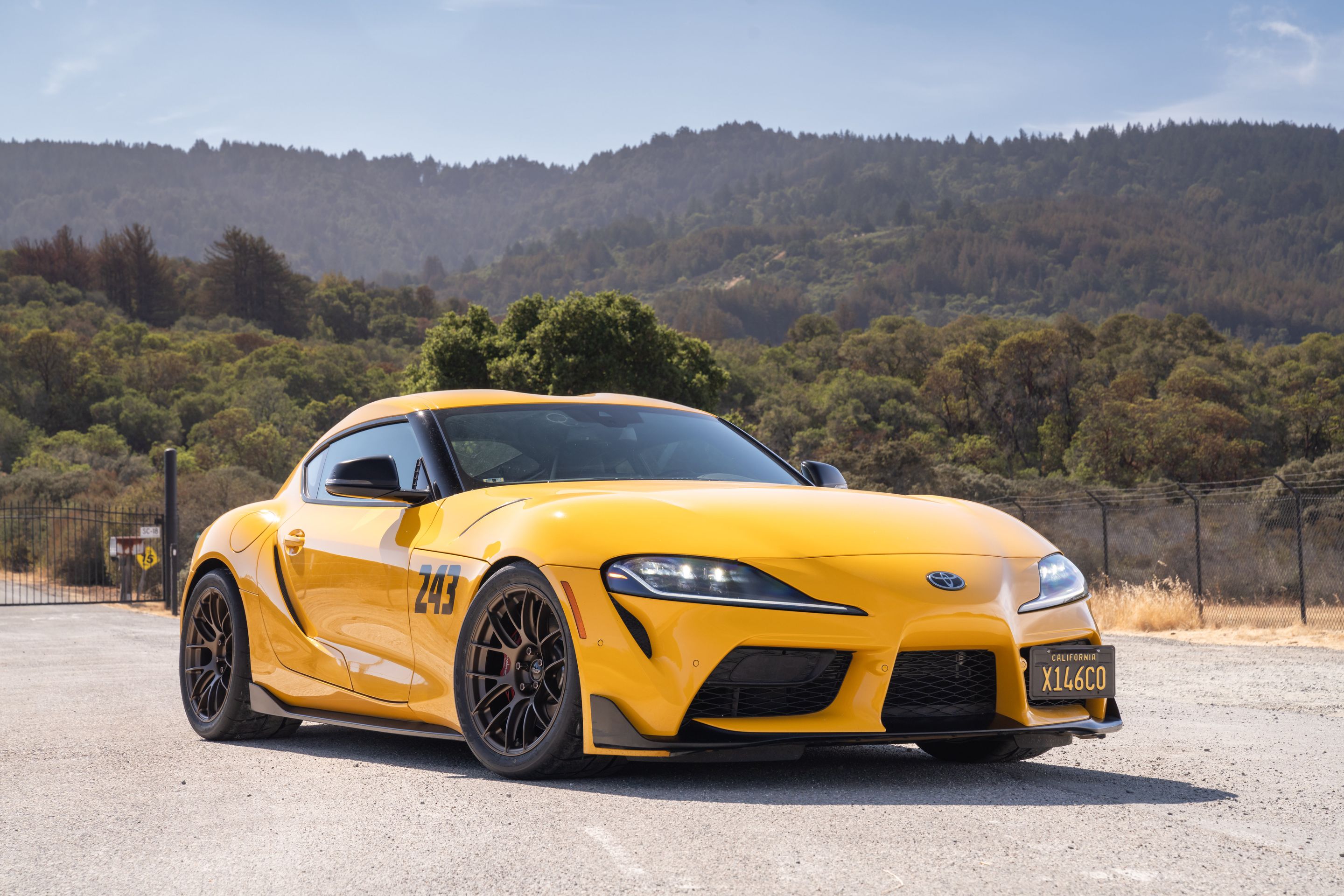 Yellow Toyota GR Supra with 18" EC-7RS Apex wheels in Satin Bronze