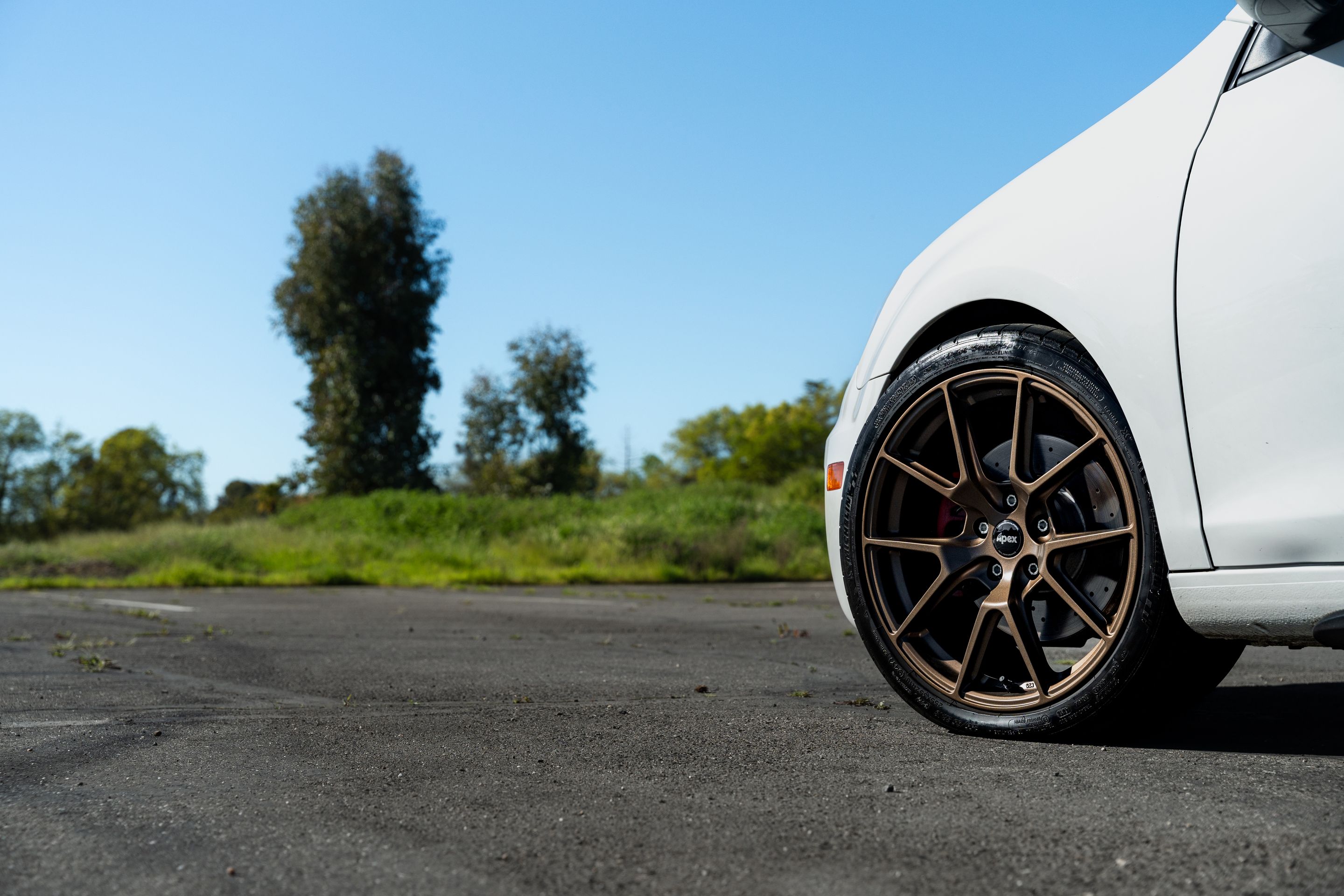 White VW MK6 GTI with 18" VS-5 Apex wheels in Satin Bronze
