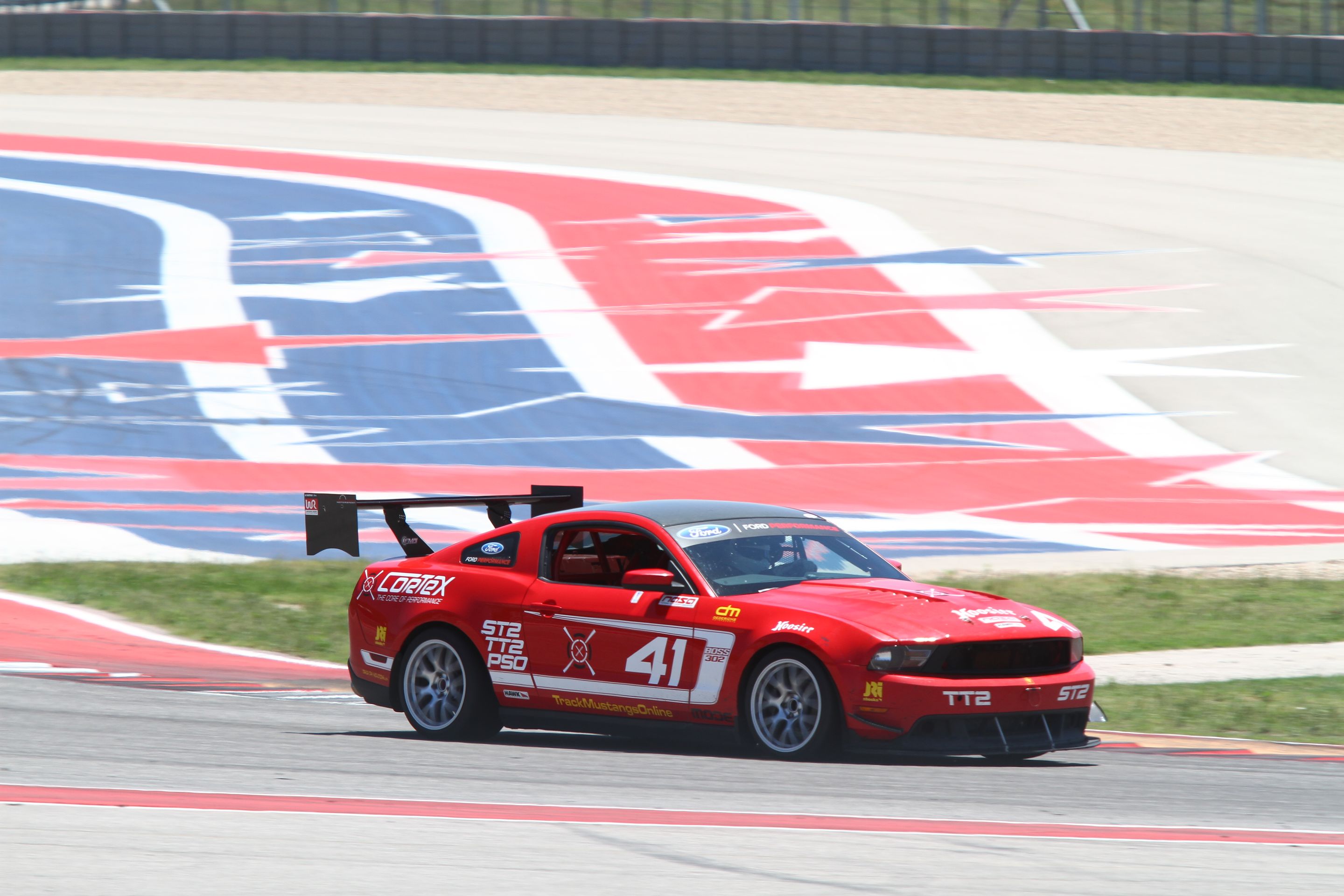 Red Ford S197 Mustang Boss 302 with 18" EC-7 Apex wheels in Race Silver