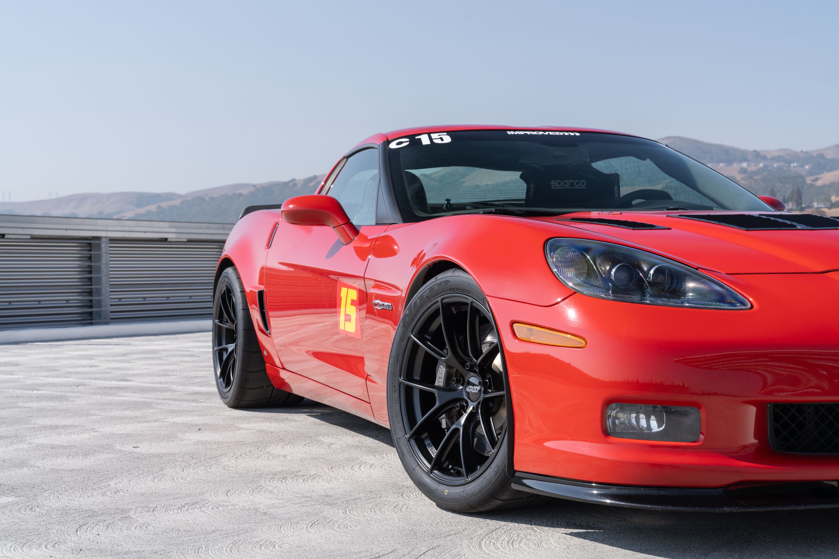 Red Chevrolet C6 Corvette Z06 with 18" VS-5RS Apex wheels in Satin Black