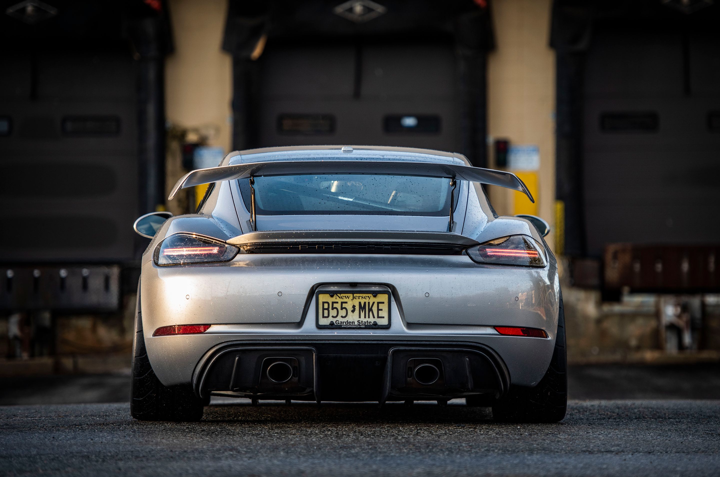 Silver Porsche 718 Cayman GT4 with 19" VS-5RS Apex wheels in Satin Black