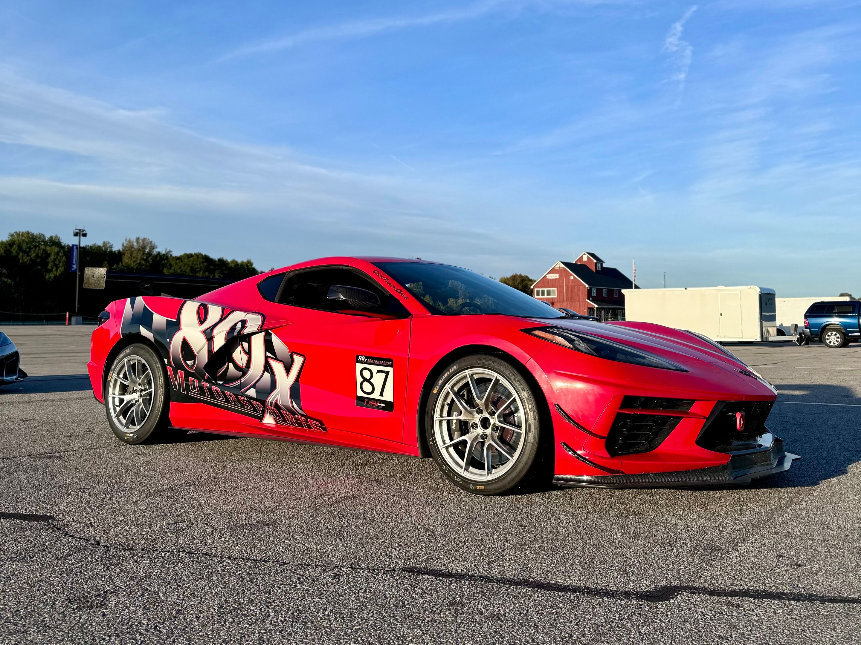 Red Chevrolet C8 Corvette Stingray/Z51 with 18" VS-5RS Apex wheels in Brushed Clear