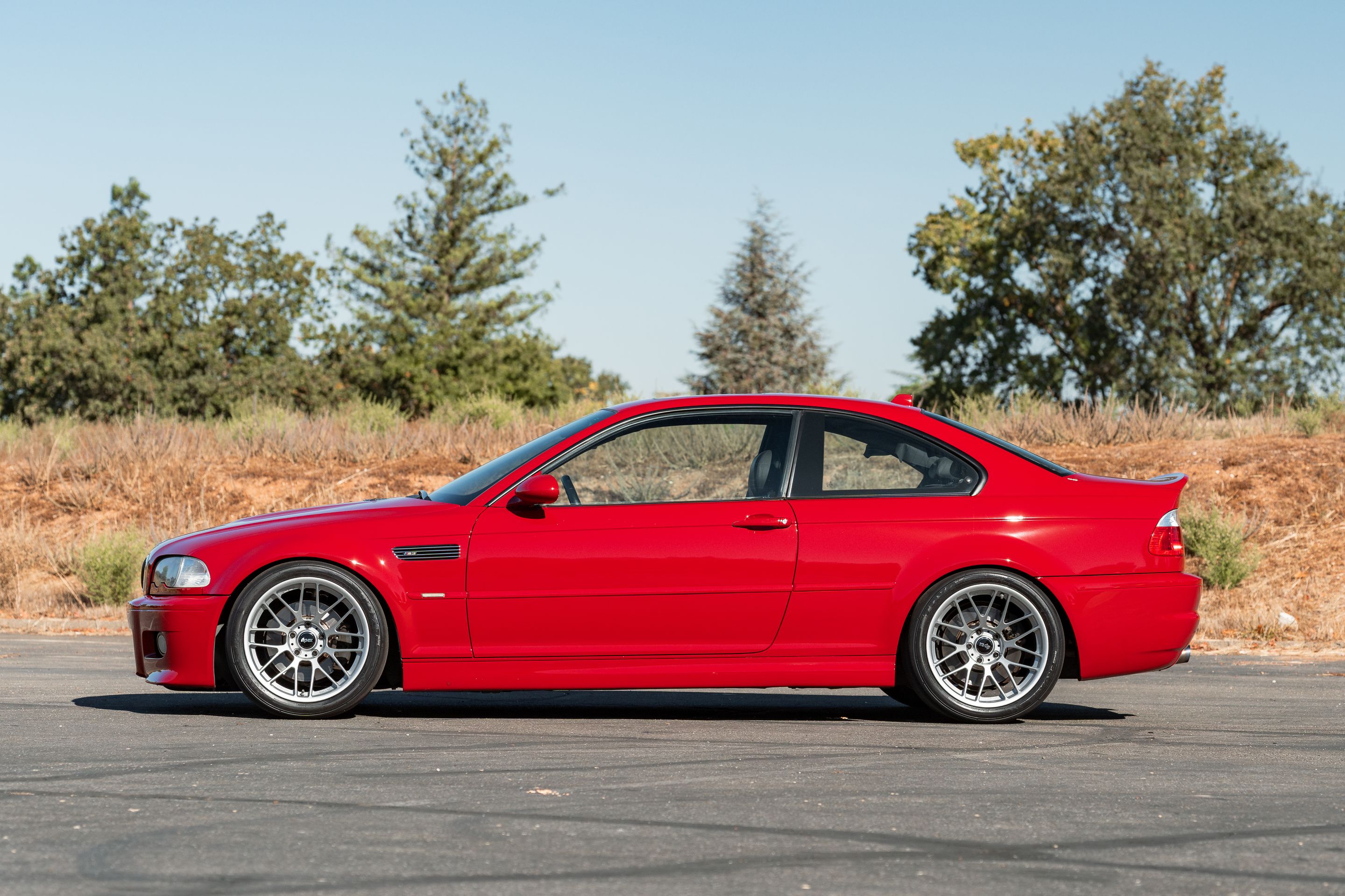 Red BMW E46 M3 with 18" ARC-8RT Apex wheels in Race Silver