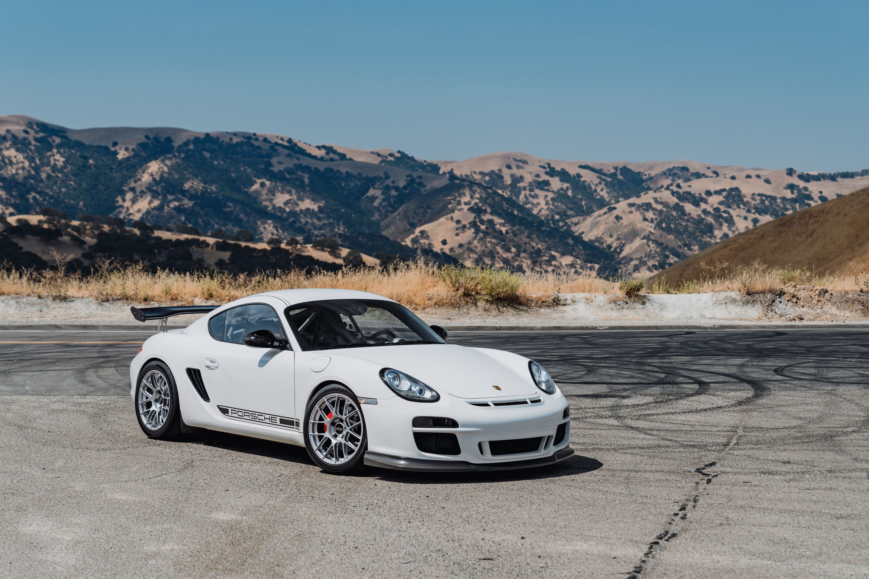 White Porsche 987 Cayman R with 18" EC-7RS Apex wheels in Race Silver