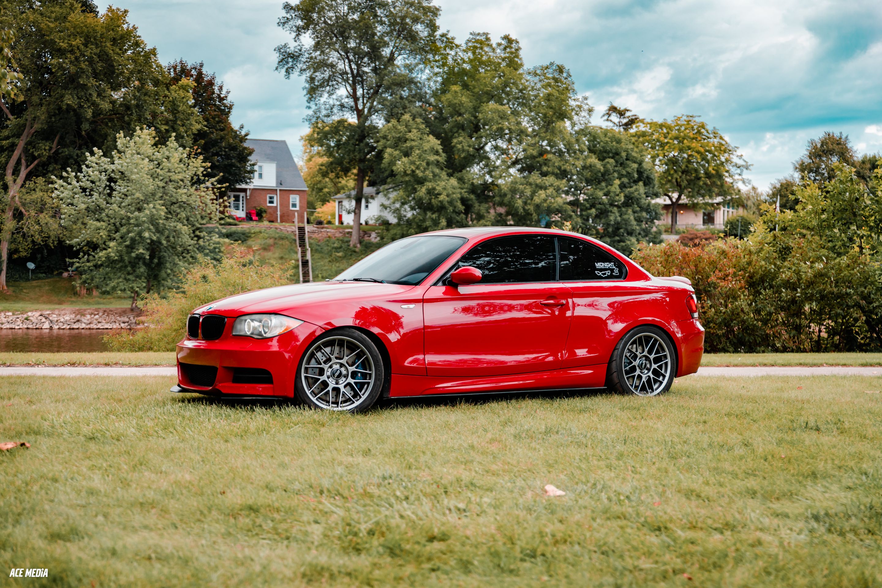 Red BMW E82 Coupe 1 Series with 18" ARC-8 Apex wheels in Hyper Black