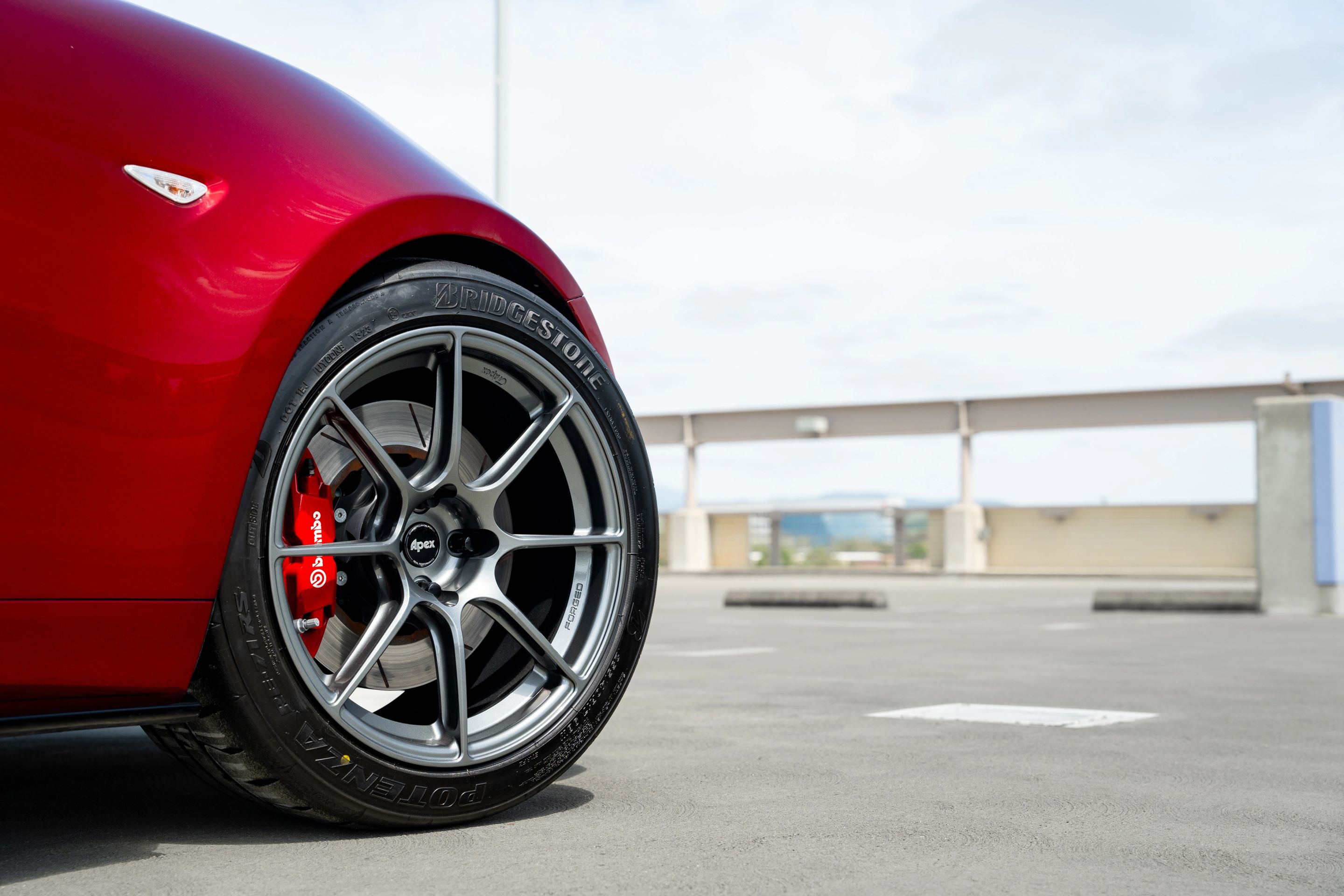 Red Mazda ND MX-5 Miata with 17" SM-8RS Apex wheels in Anthracite