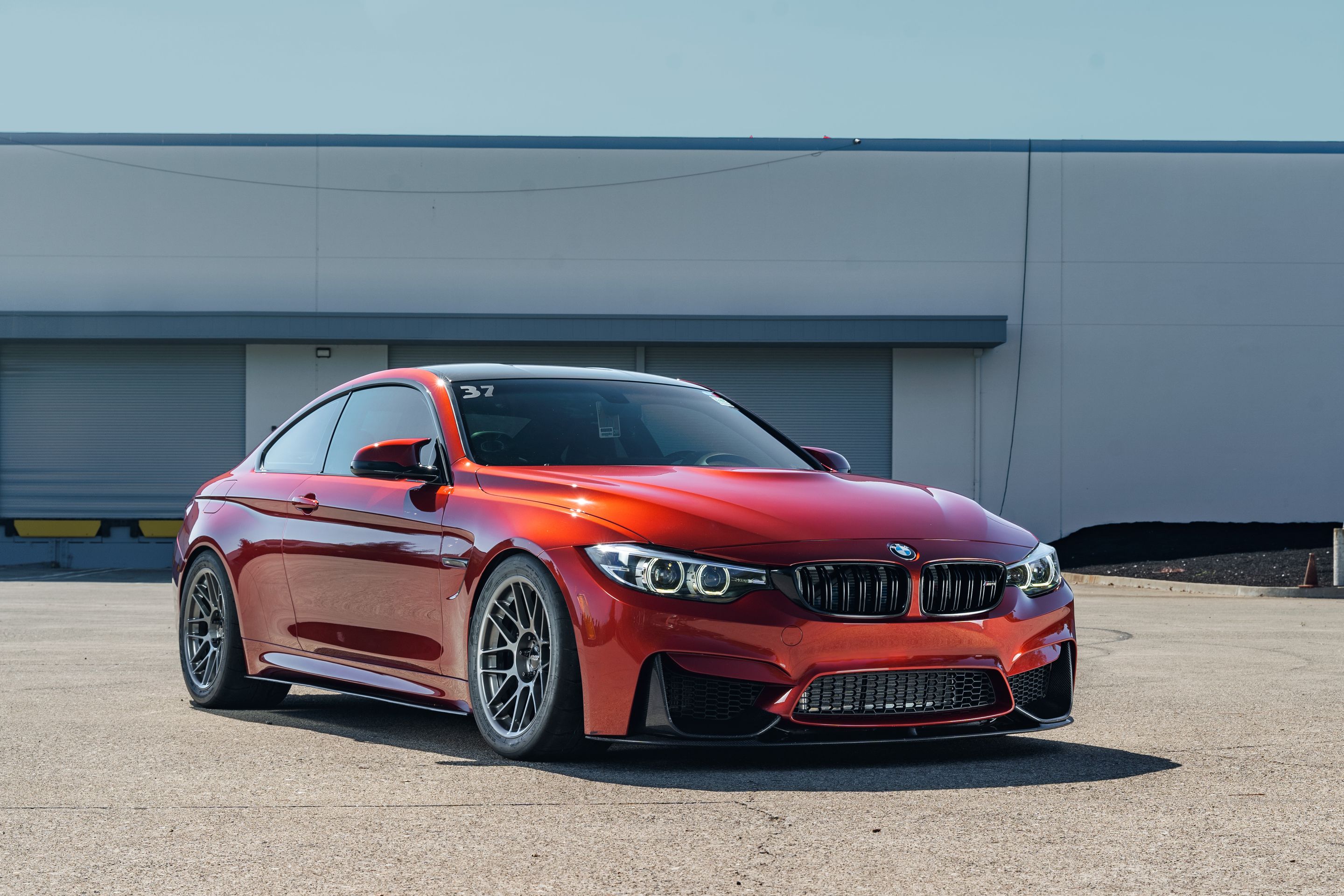 Orange BMW F82 Coupe M4 with 18" ARC-8 Apex wheels in Anthracite