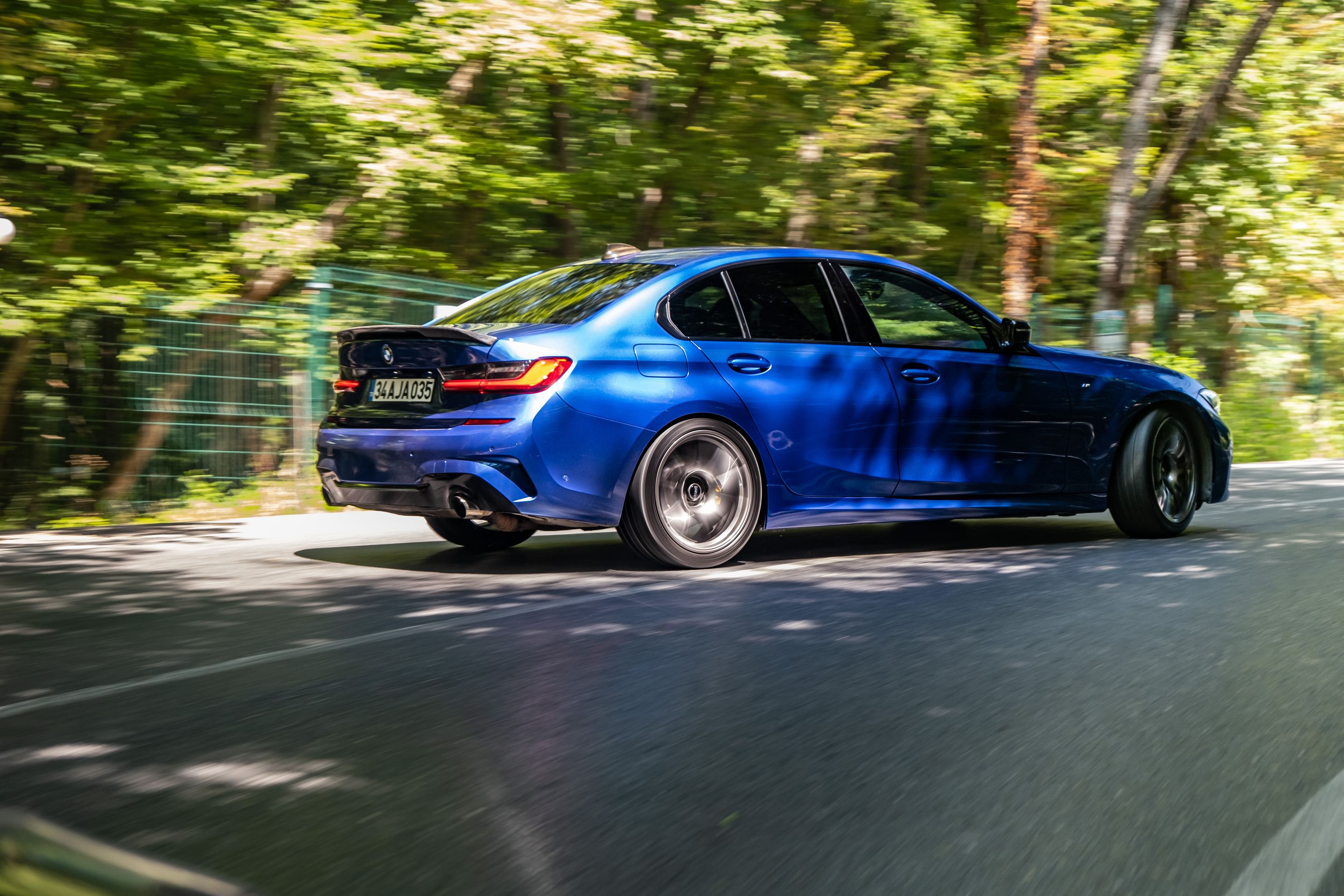Blue BMW G20 Sedan 3 Series with 19" SM-10 Apex wheels in Anthracite