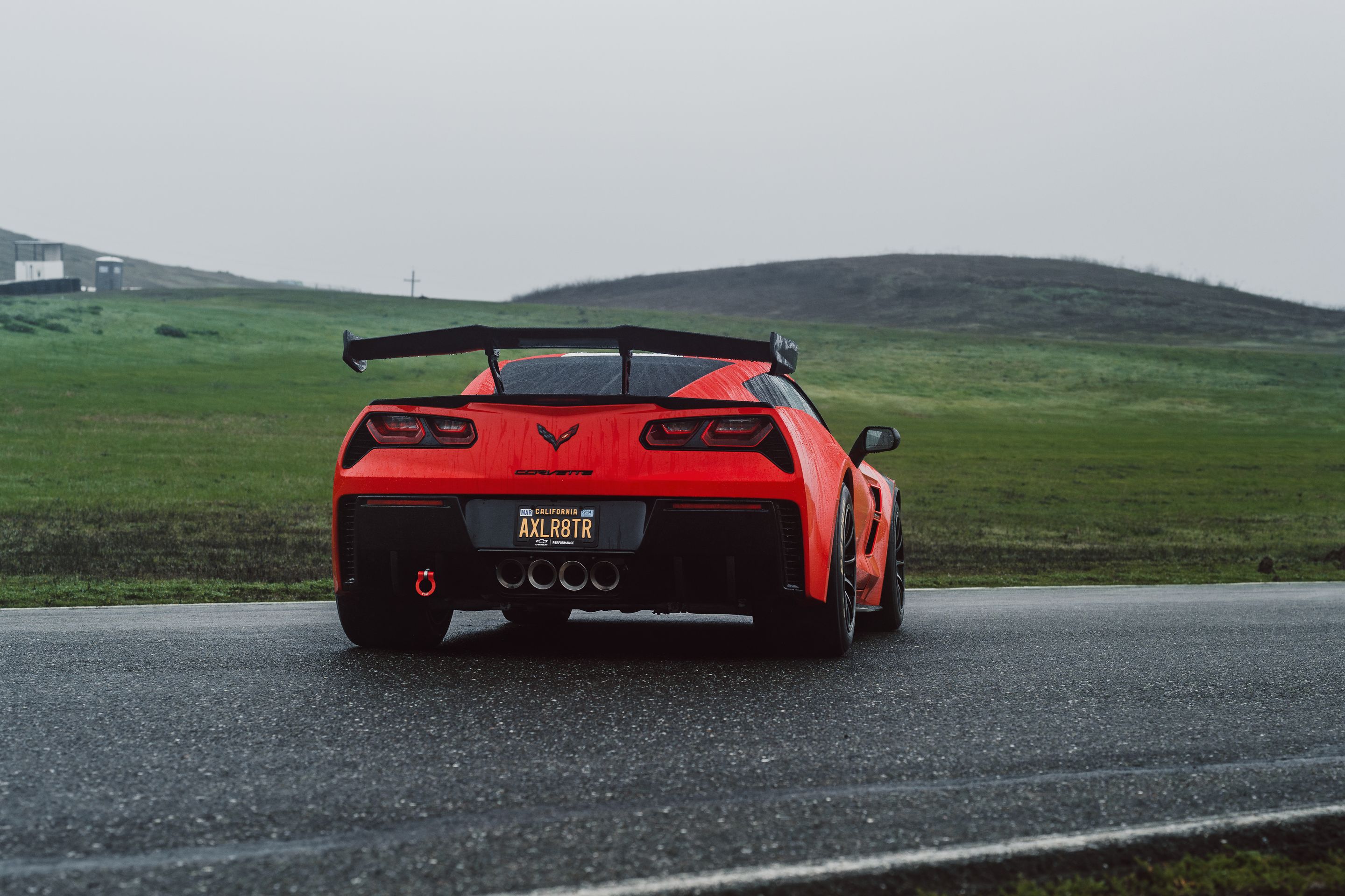 Red Chevrolet C7 Corvette Grand Sport with 18" SM-10RE Apex wheels in Satin Black