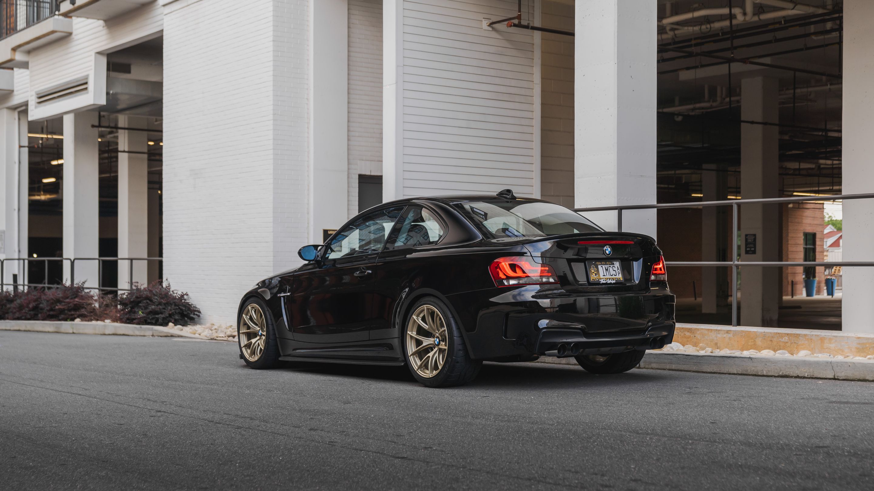 Black BMW E82 Coupe 1 Series with 18" VS-5RS Apex wheels in Motorsport Gold