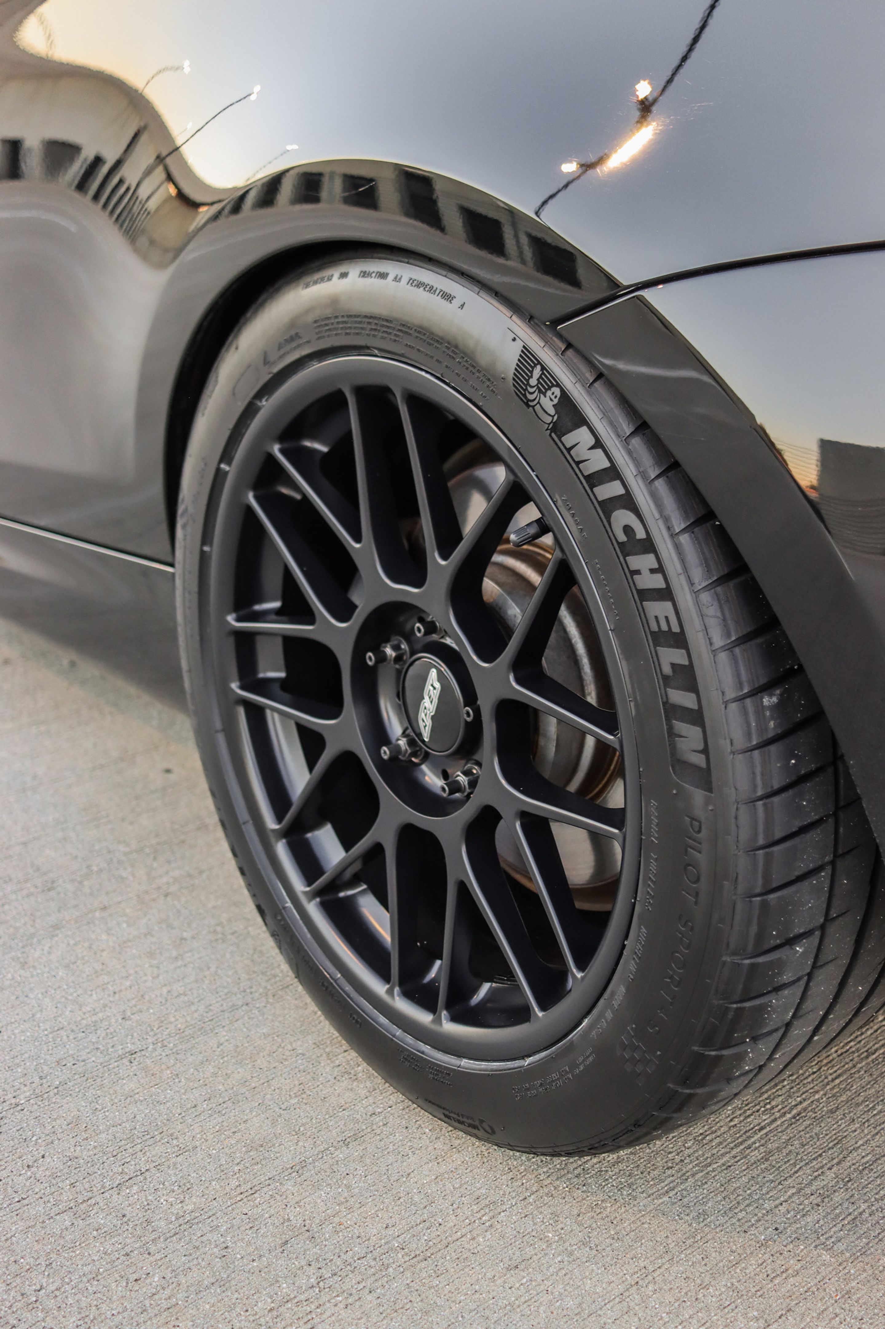 Black BMW E82 Coupe 1 Series with 18" ARC-8 Apex wheels in Satin Black