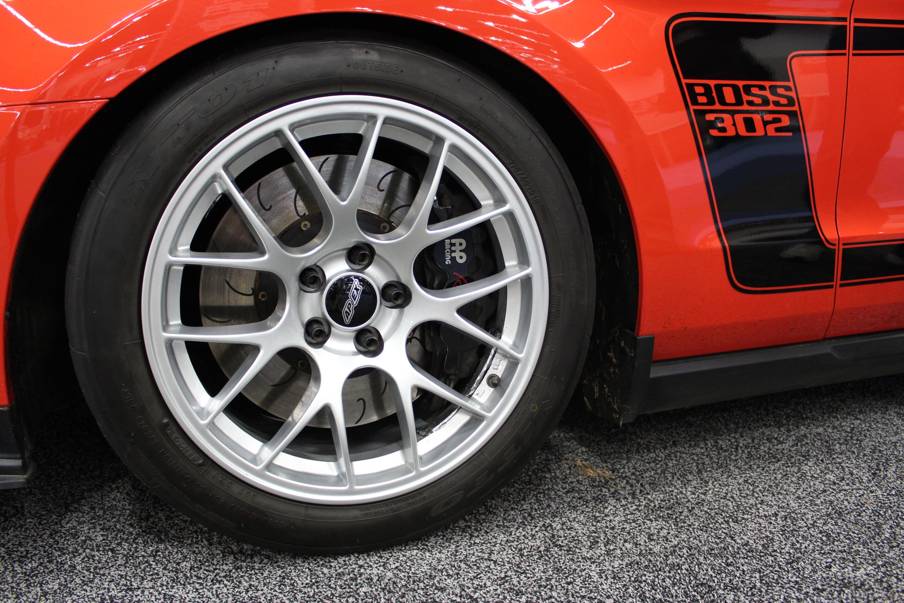 Orange Ford S197 Mustang Boss 302 with 18" EC-7 Apex wheels in Race Silver