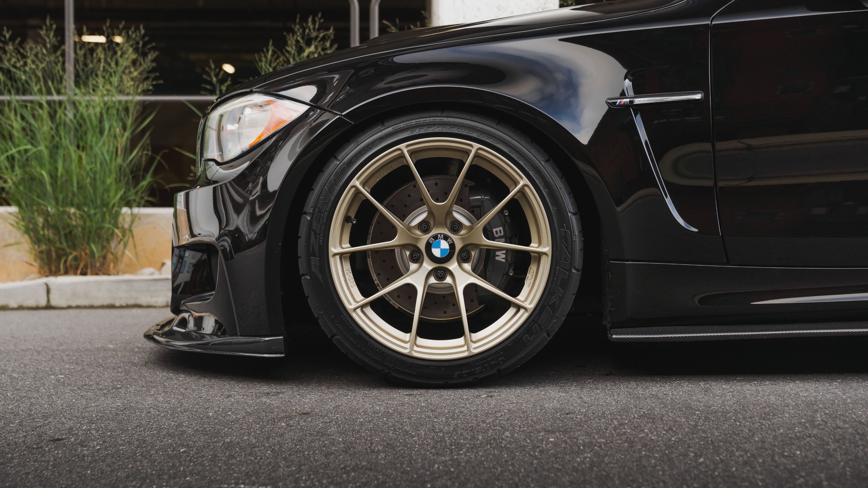 Black BMW E82 Coupe 1 Series with 18" VS-5RS Apex wheels in Motorsport Gold