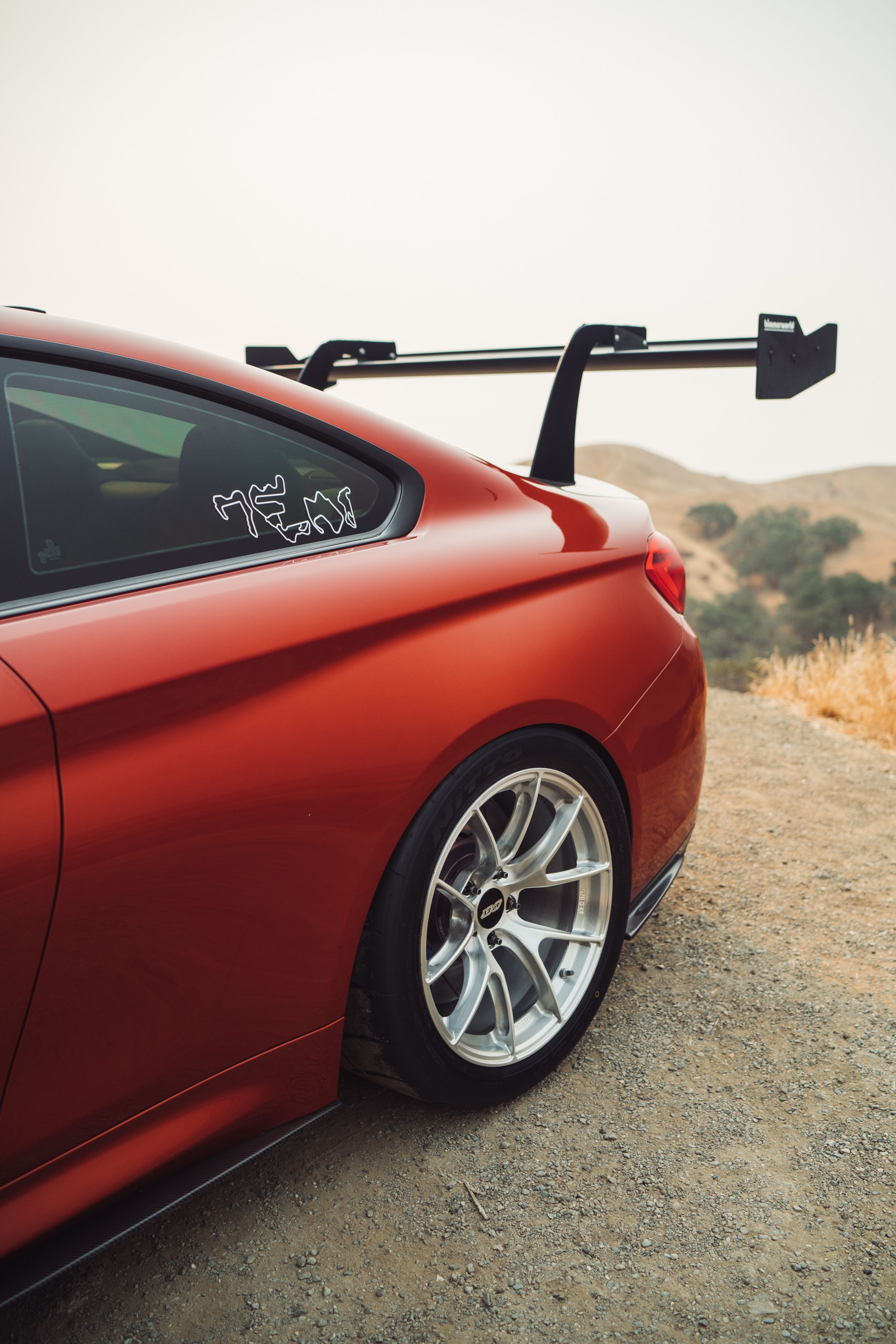 Orange BMW F82 Coupe M4 with 18" VS-5RS Apex wheels in Brushed Clear