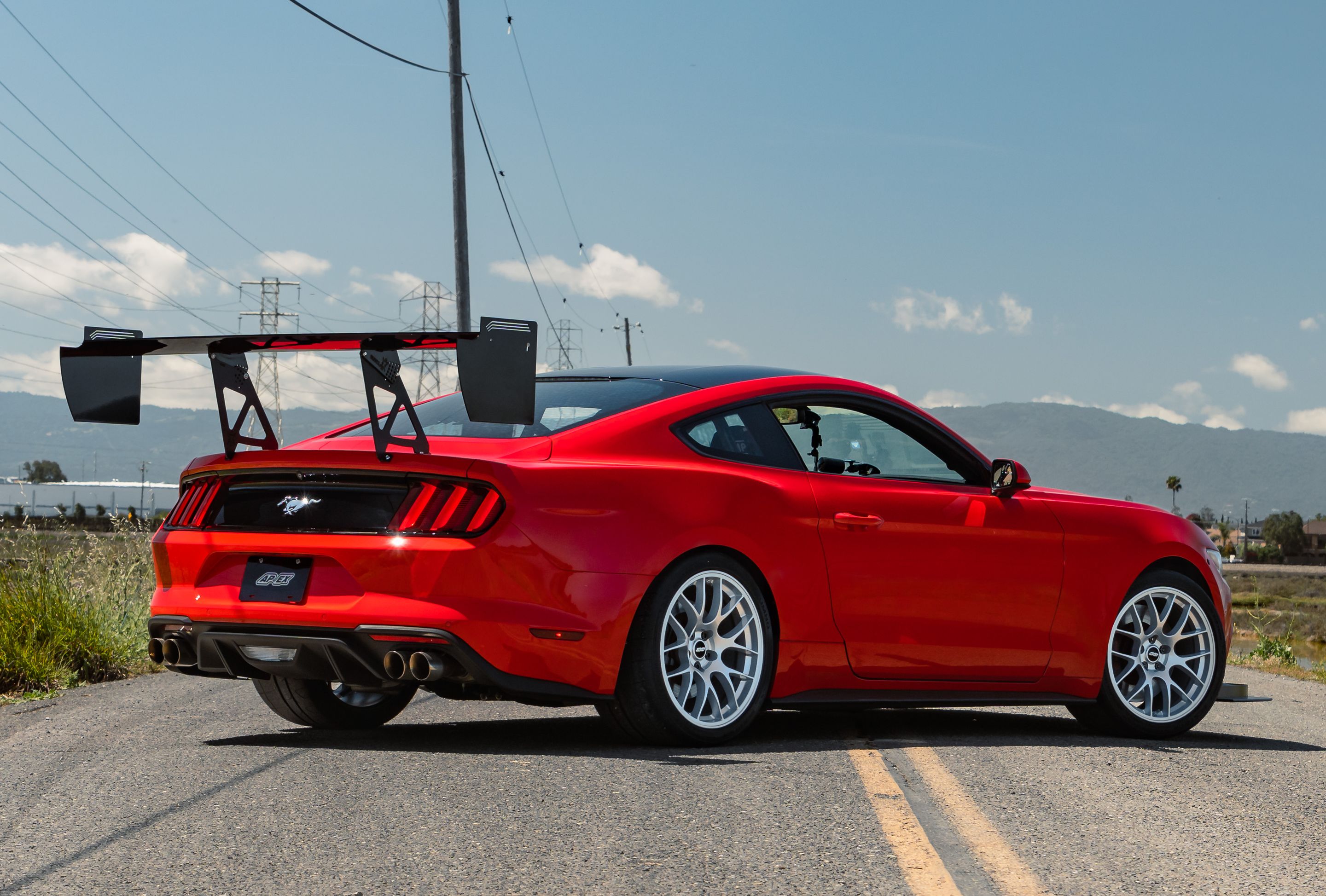 Red Ford S550 Mustang GT with 19" EC-7 Apex wheels in Race Silver