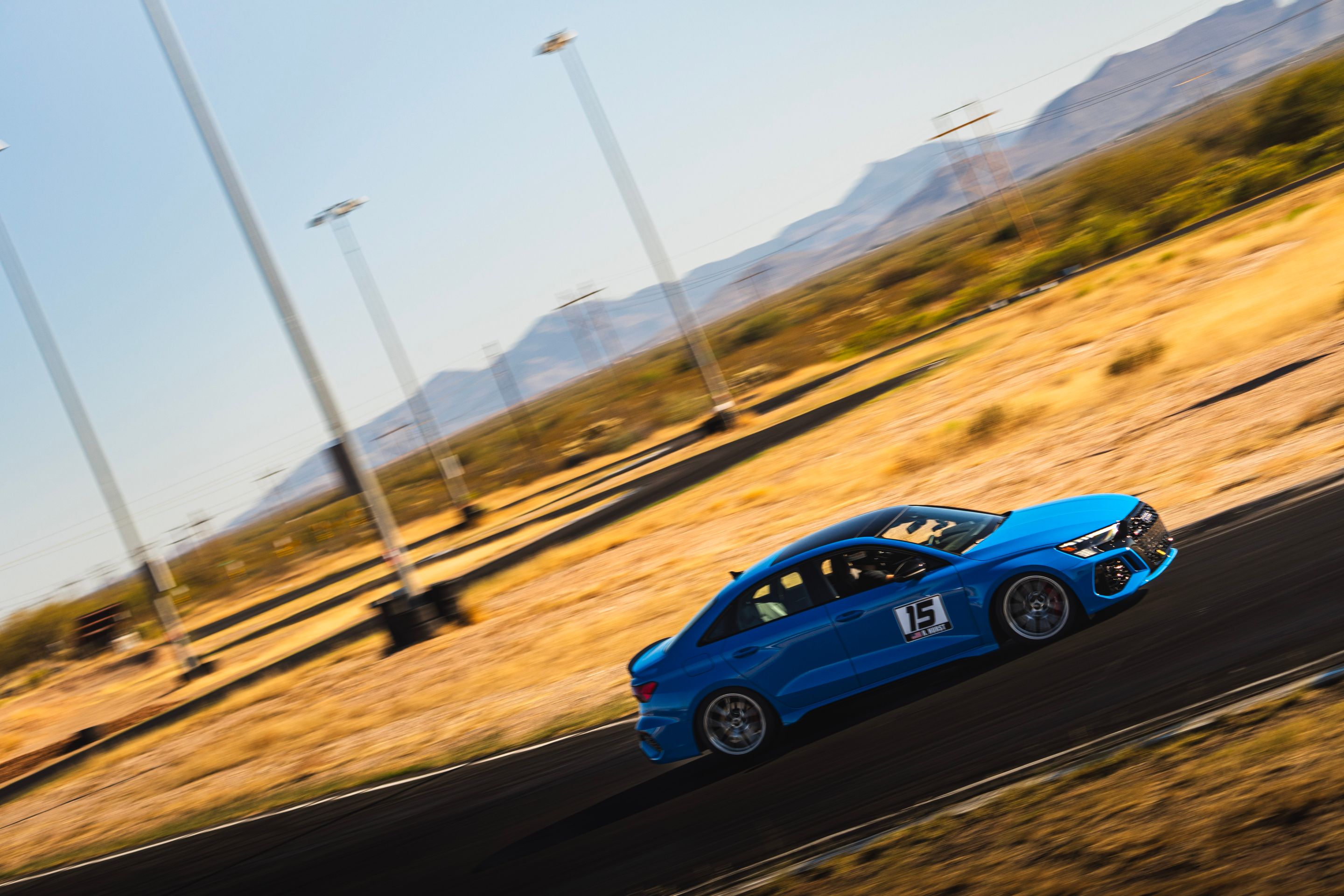 Blue Audi 8Y RS 3 with 18" VS-5RS Apex wheels in Brushed Clear