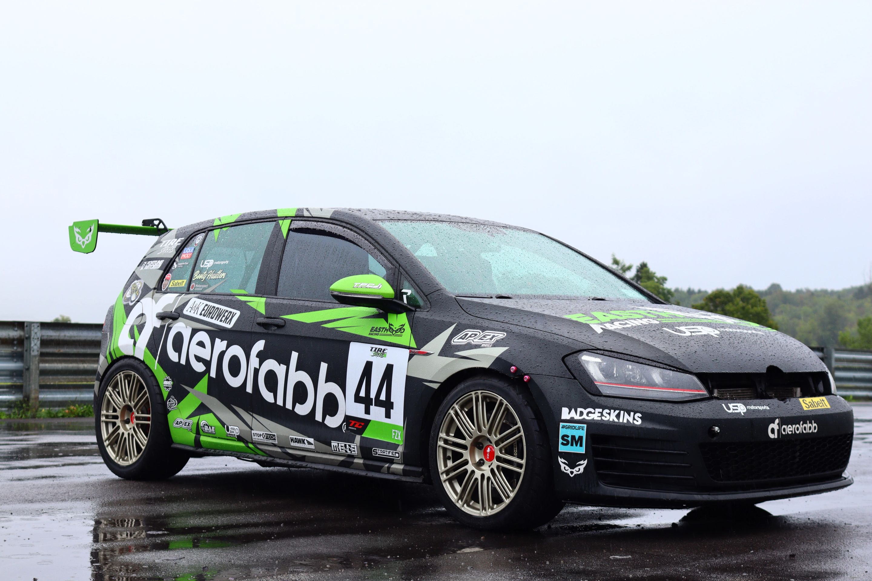 Race Livery VW MK7 GTI with 18" TC-10RT Apex wheels in Motorsport Gold
