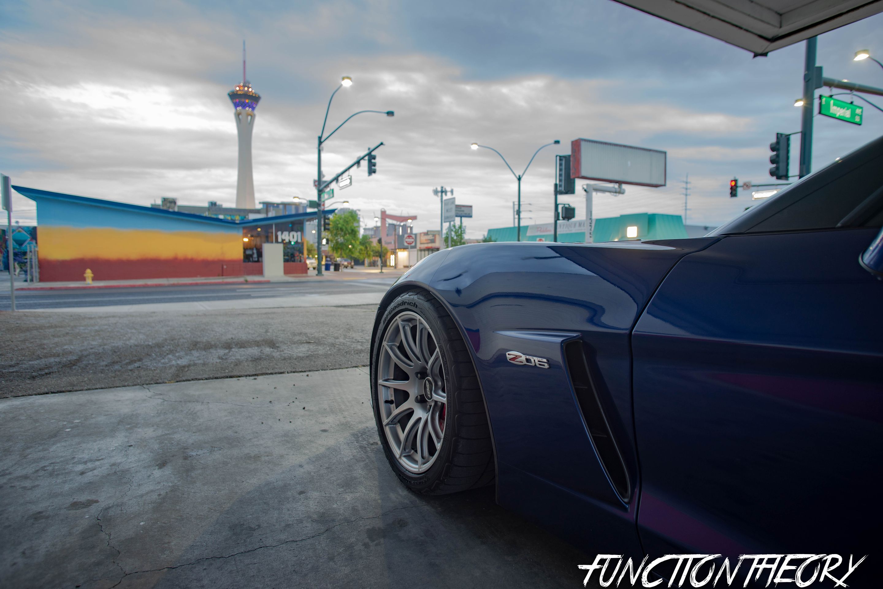 Blue Chevrolet C6 Corvette Z06 with 18" SM-10 Apex wheels in Race Silver