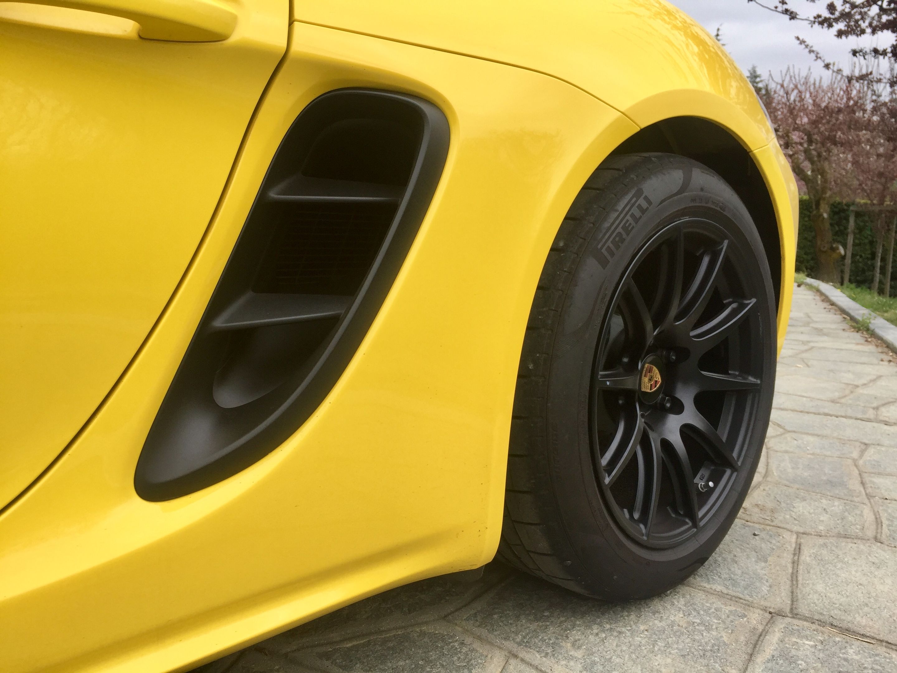 Yellow Porsche 718 Cayman Base with 18" SM-10 Apex wheels in Satin Black