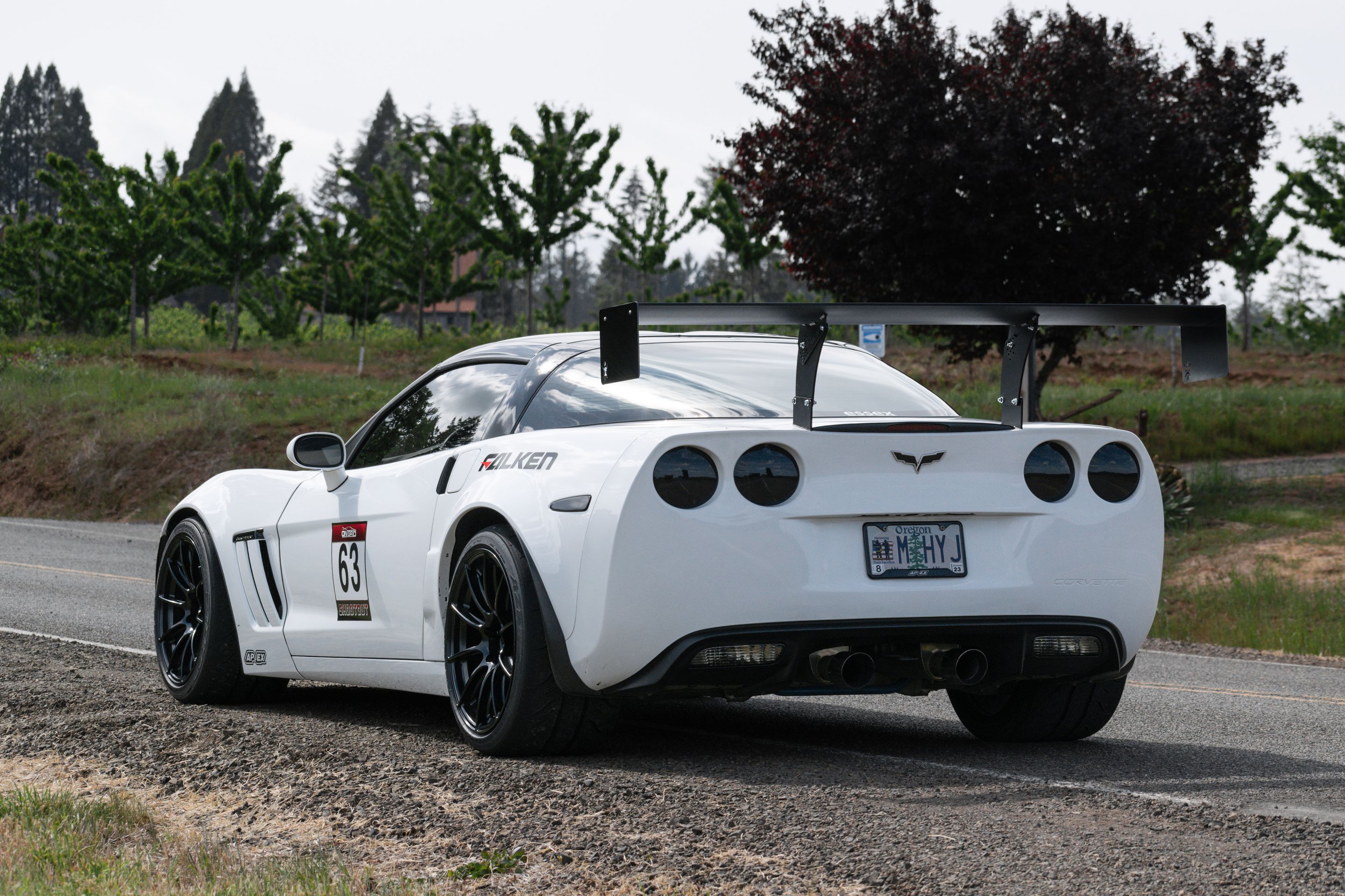 White Chevrolet C6 Corvette Grand Sport with 18"/19" SM-10RS Apex wheels in Satin Black