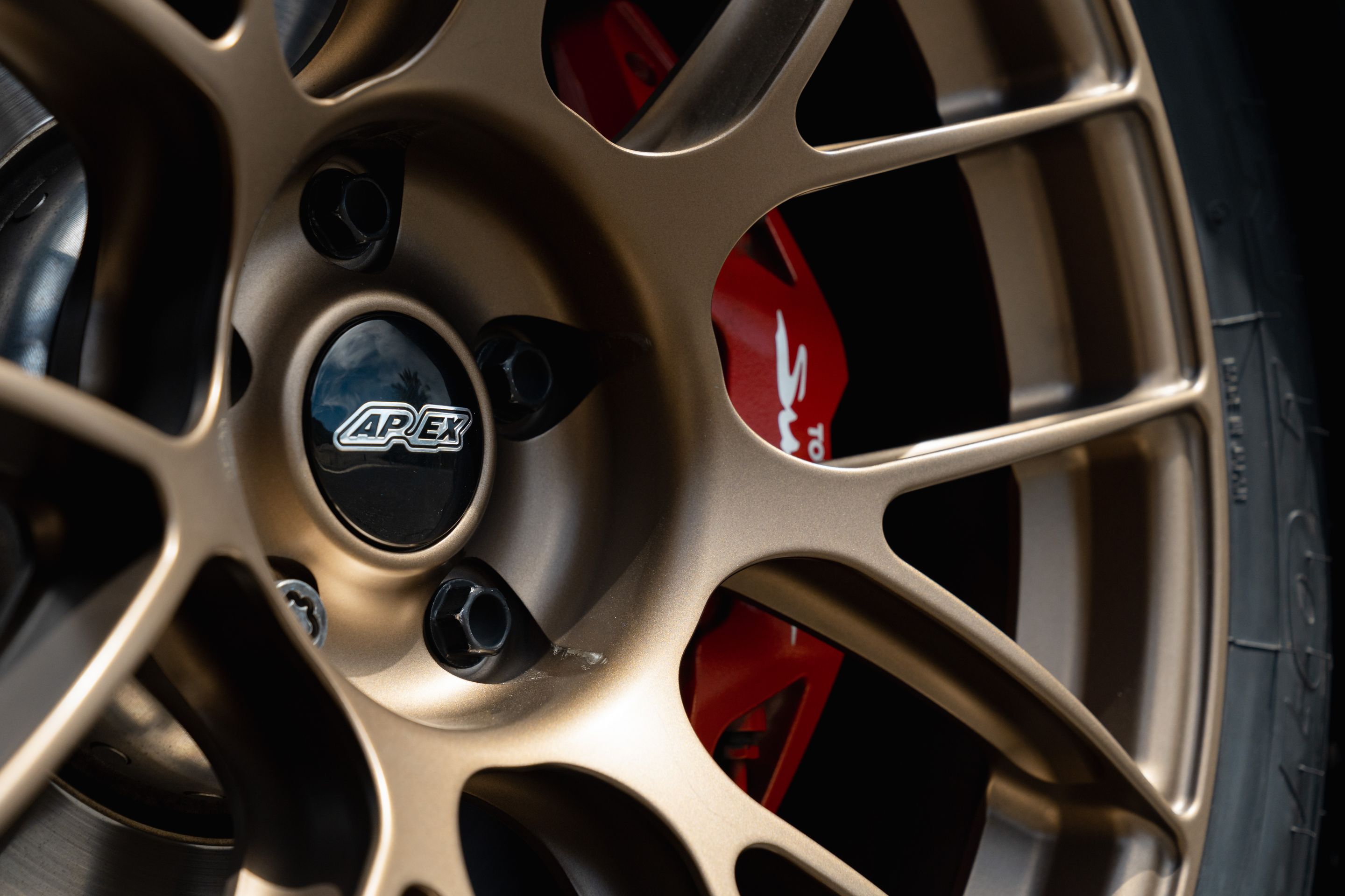 Blue Toyota GR Supra with 18" EC-7RS Apex wheels in Satin Bronze