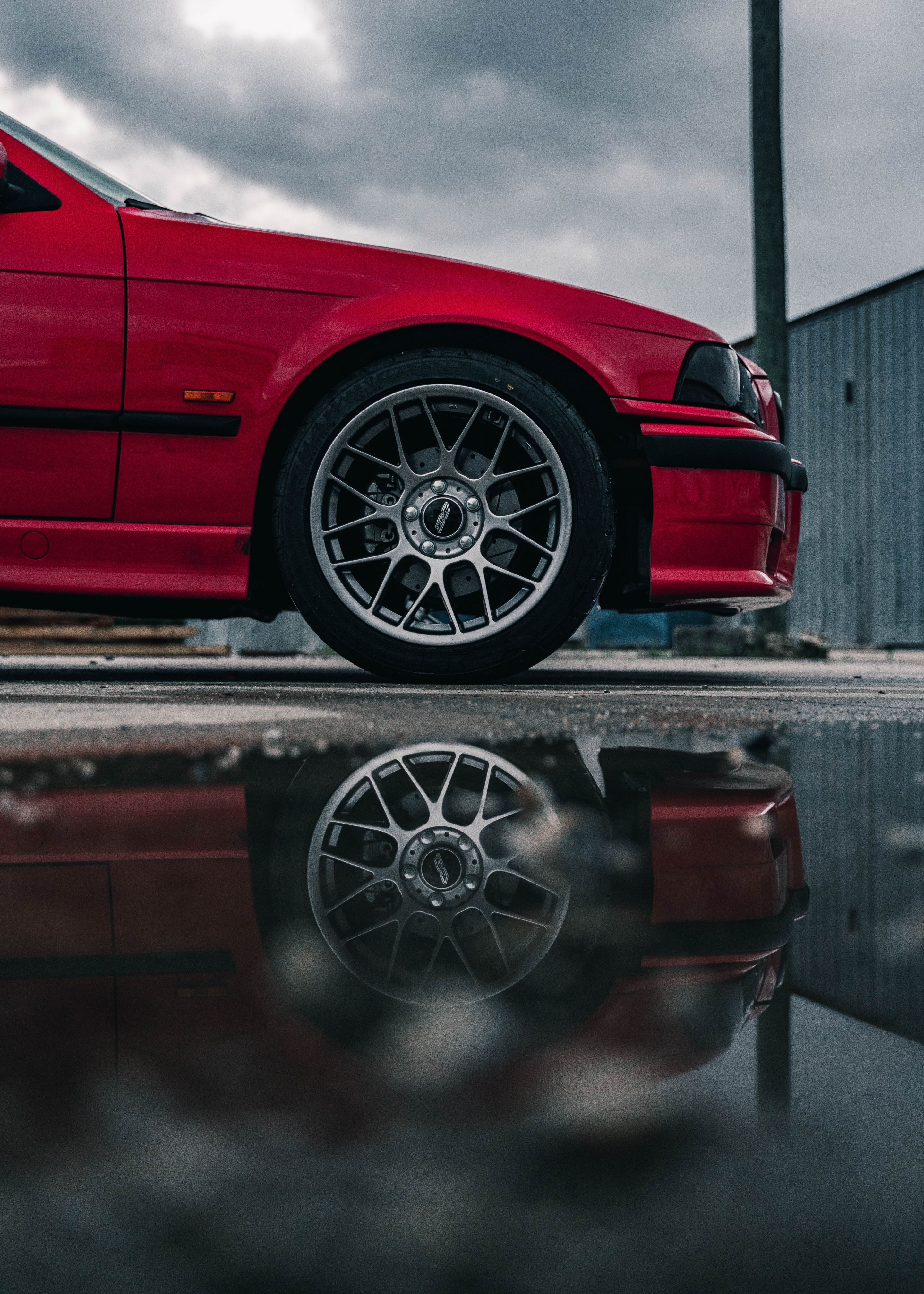 Red BMW E36 3 Series with 17" ARC-8 Apex wheels in Hyper Black