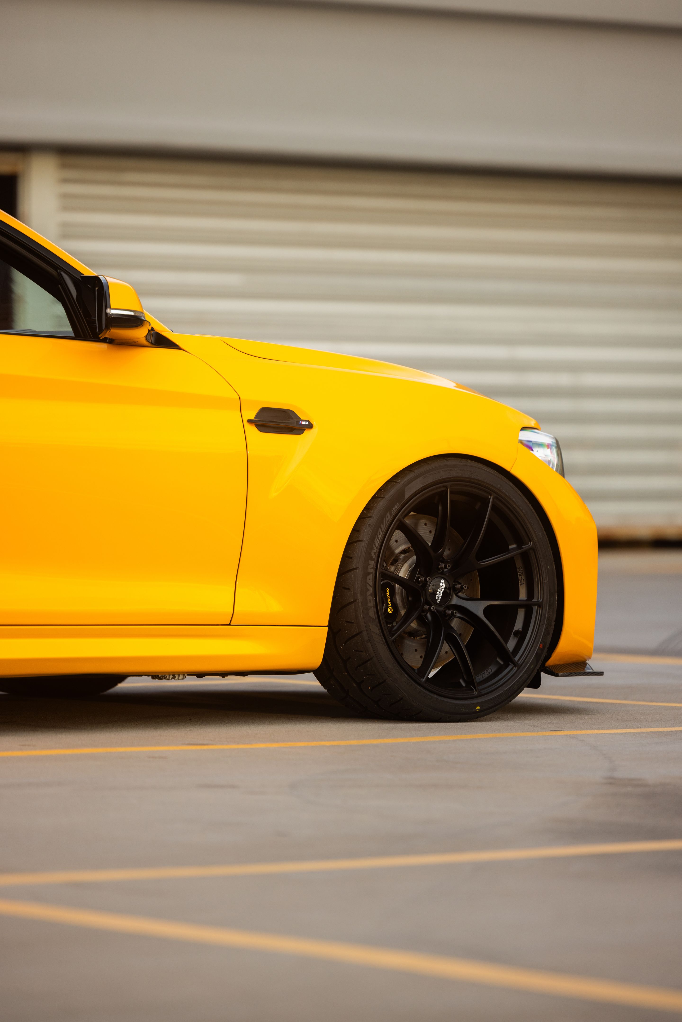 Yellow BMW F87 M2 with 19" VS-5RS Apex wheels in Satin Black