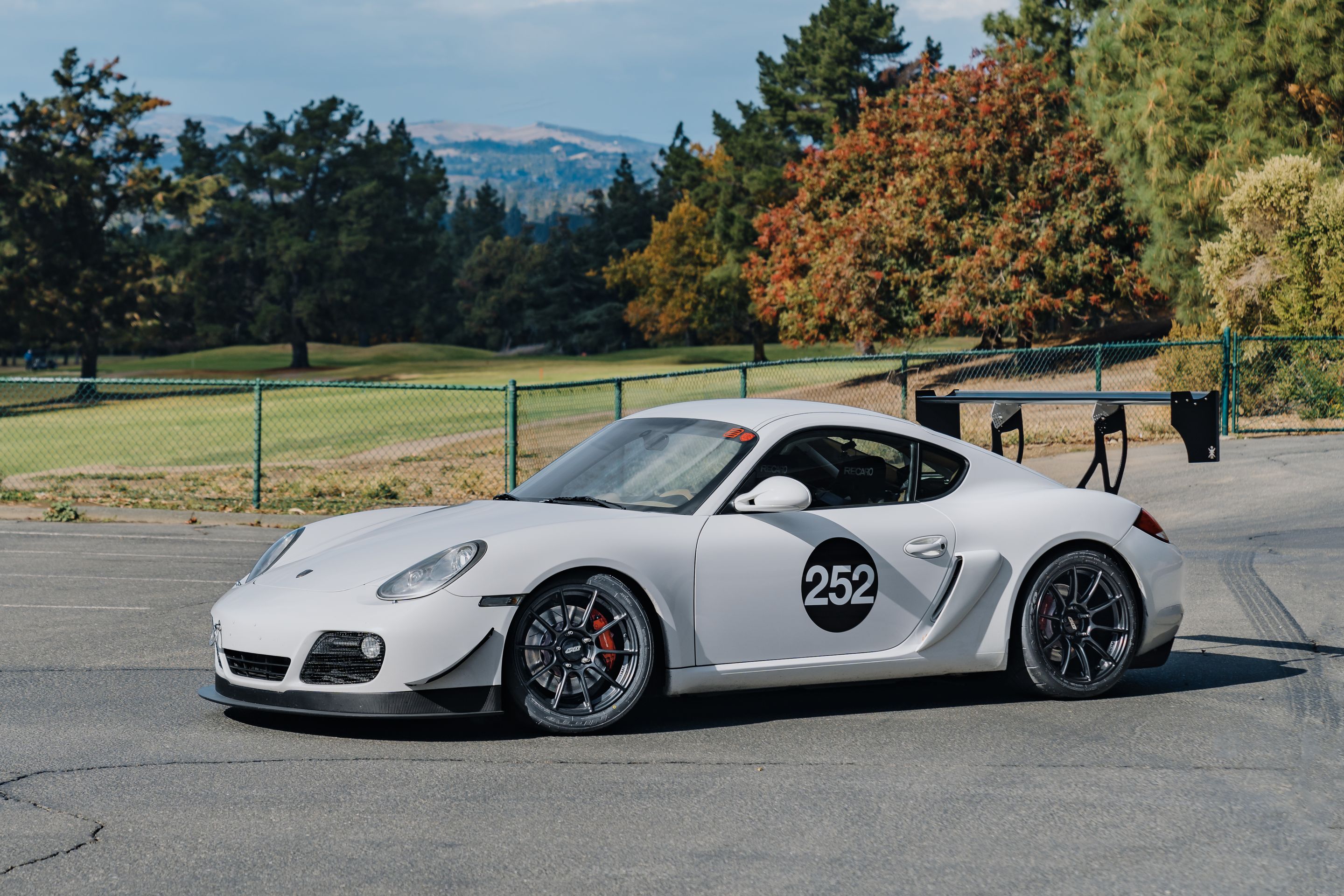 White Porsche 987 Cayman S with 18" SM-10RS Apex wheels in Satin Black