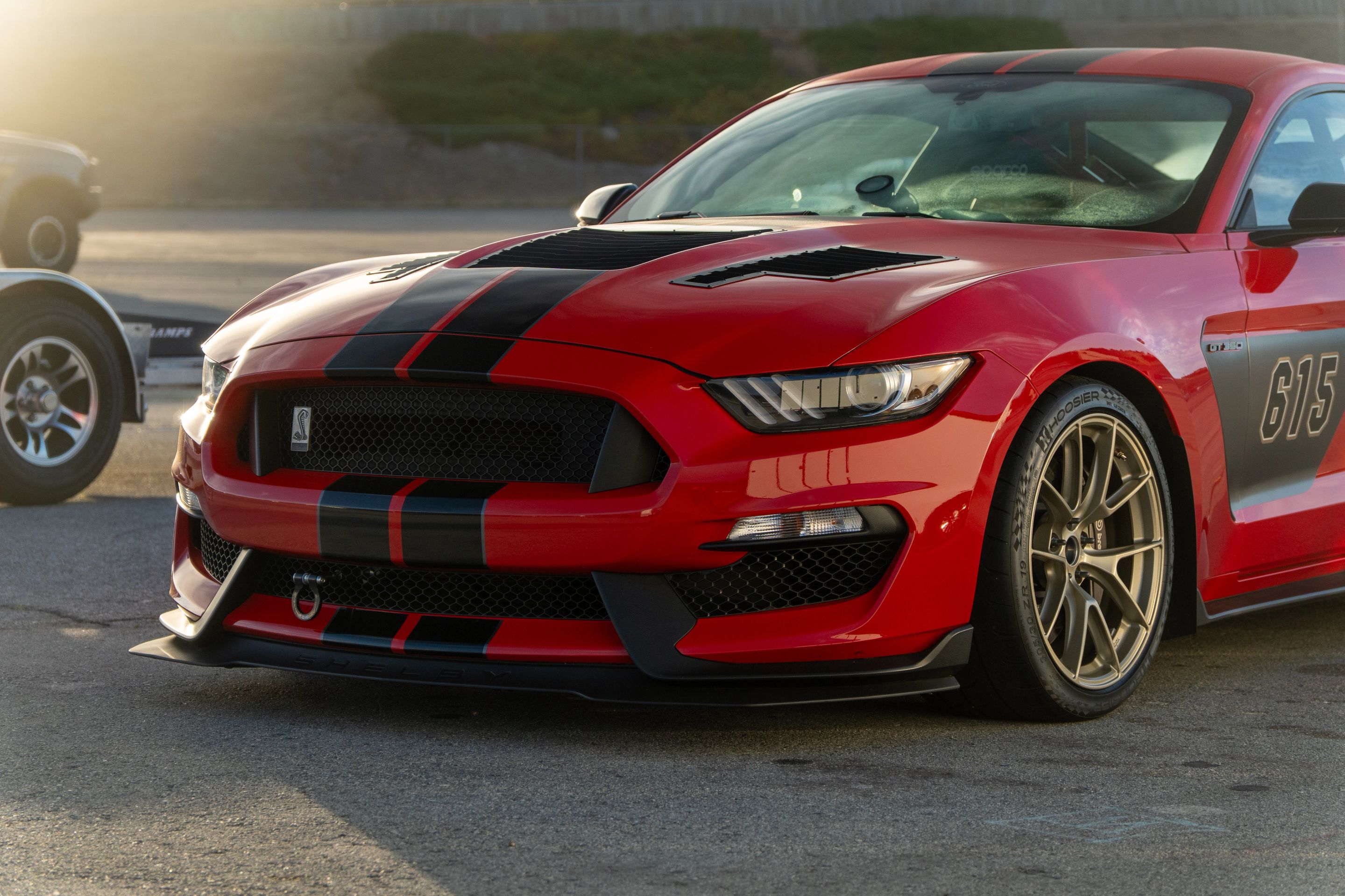 Red Ford S550 Mustang GT350 with 19" VS-5RS Apex wheels in Motorsport Gold