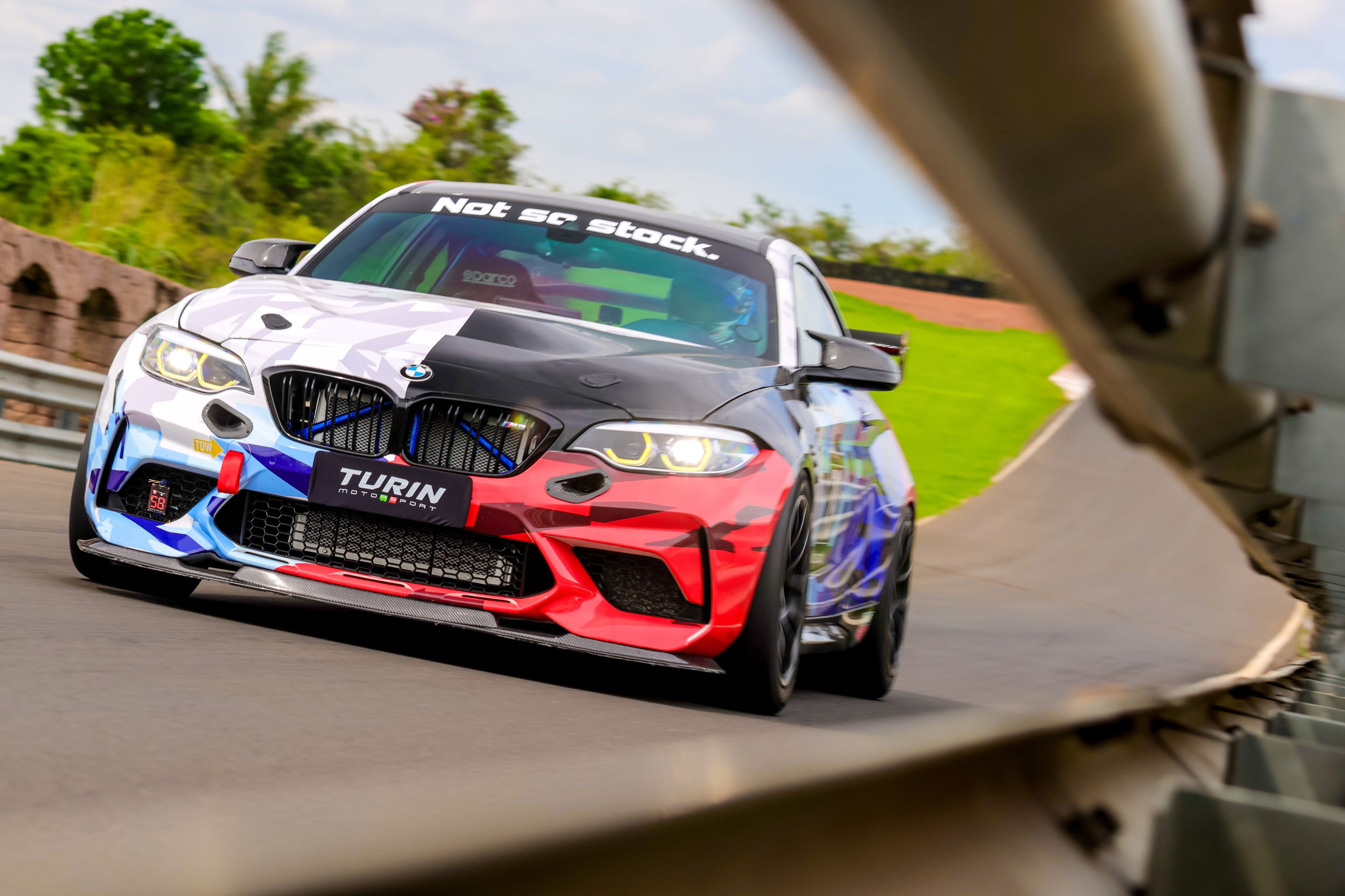 Multicolor BMW F87 M2 with 18" EC-7 Apex wheels in Satin Black