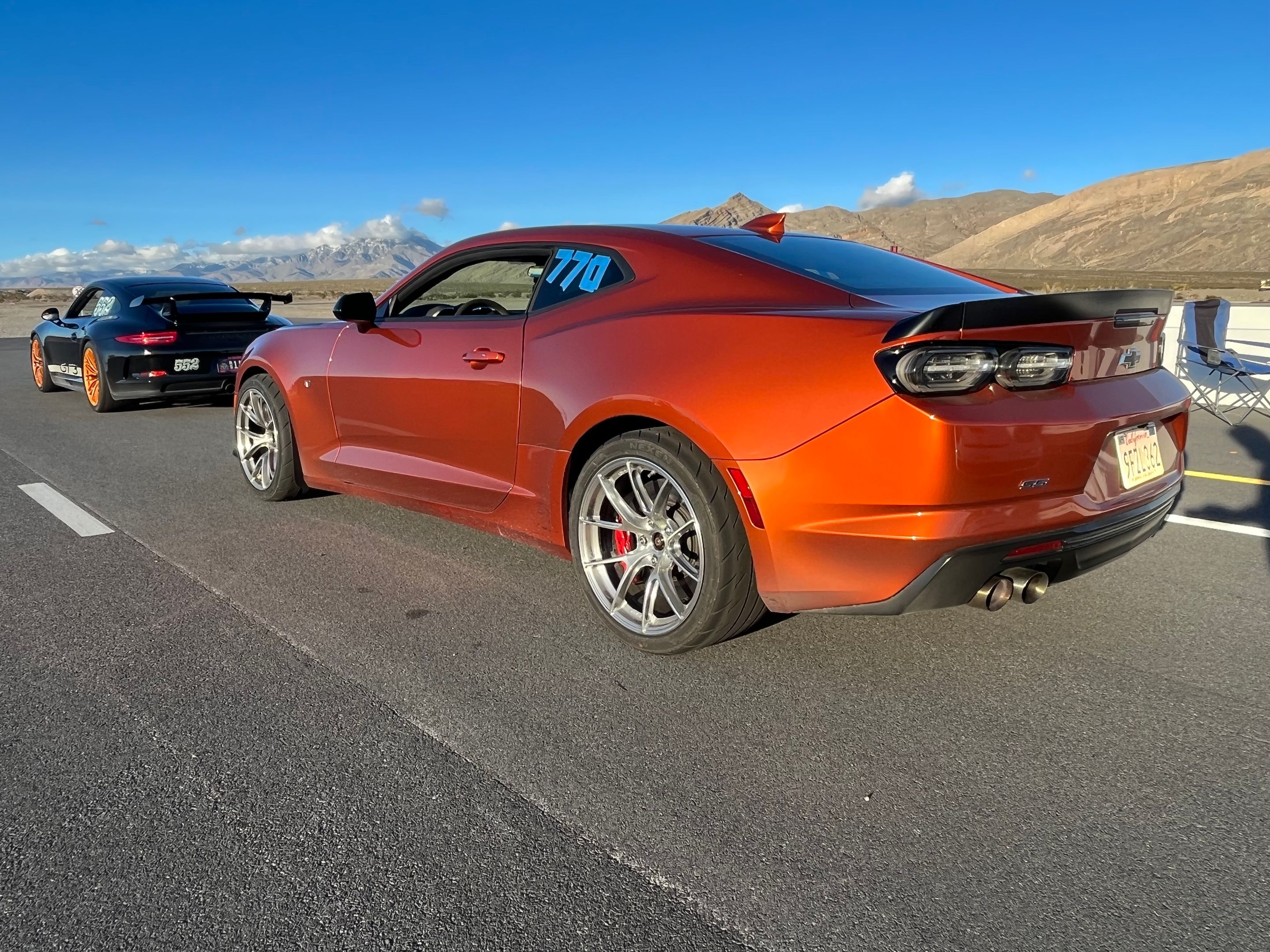Orange Chevrolet 6th Gen Camaro SS 1LE with 19" VS-5RS Apex wheels in Brushed Clear